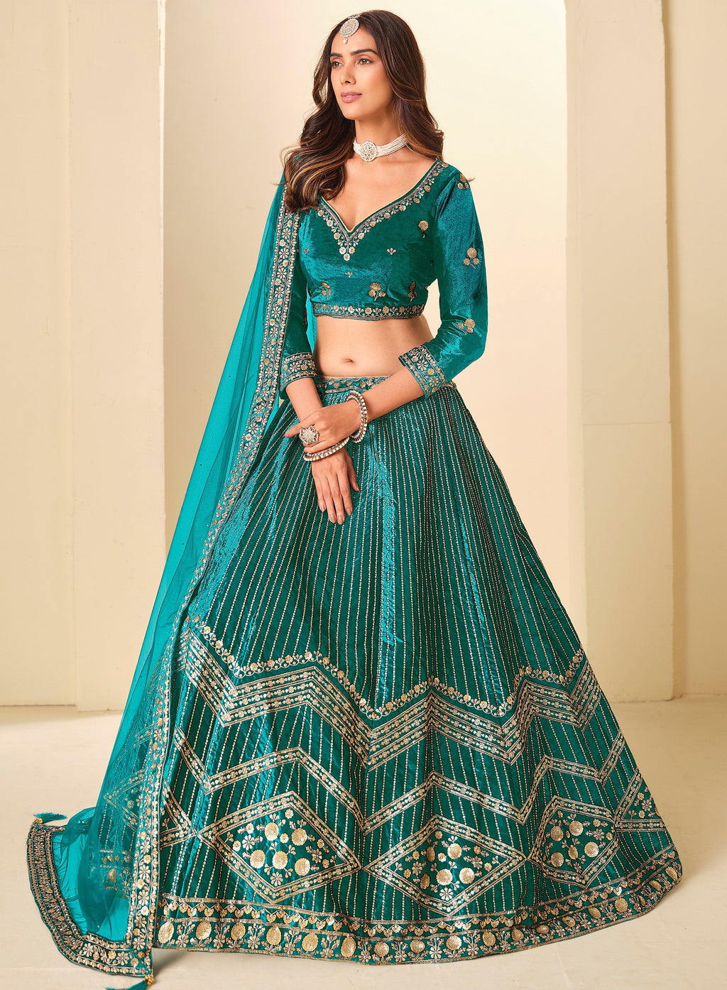 Graceful Teal Blue Embroidered Velvet Reception Wear Lehenga Choli