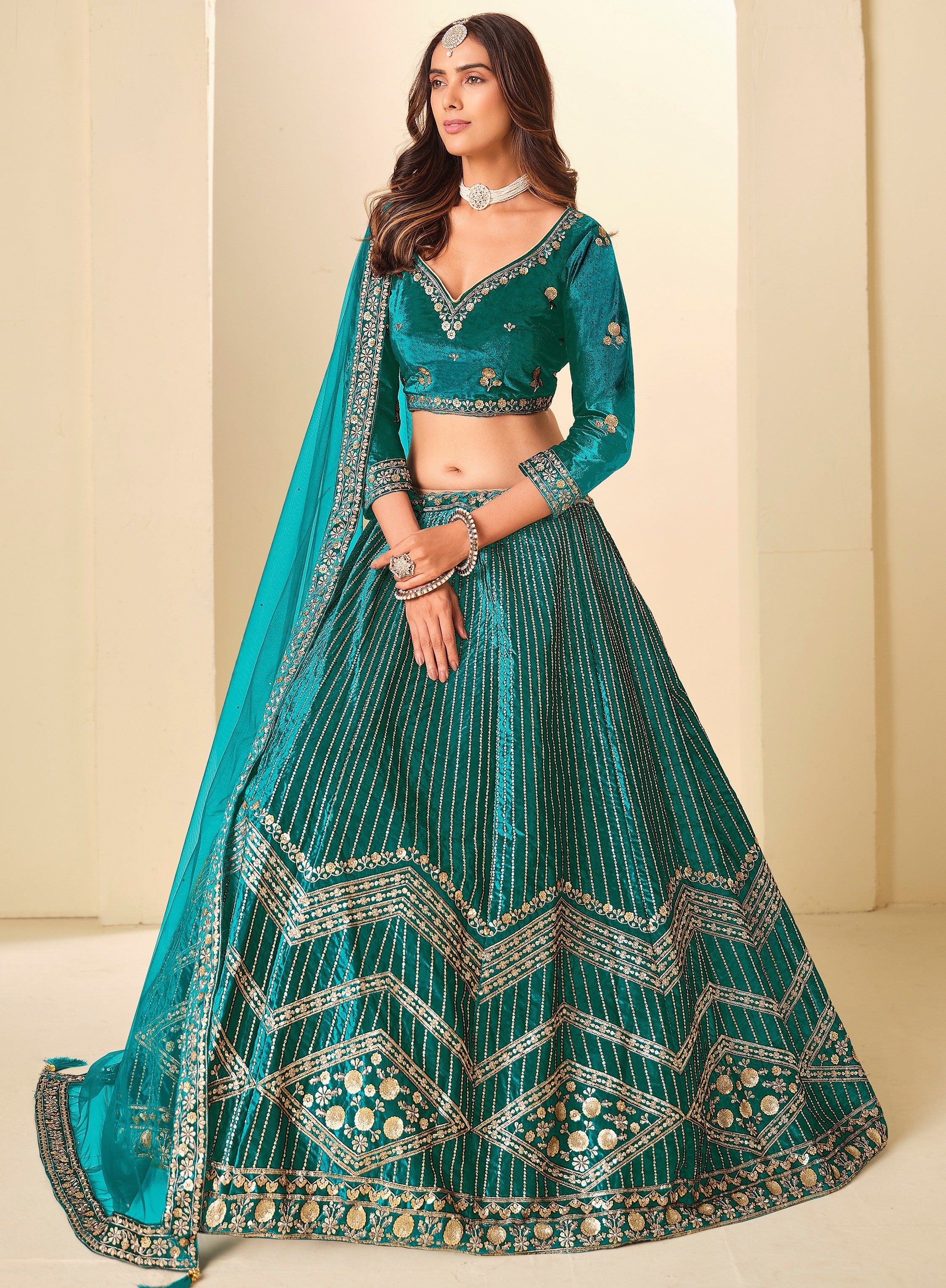 Graceful Teal Blue Embroidered Velvet Reception Wear Lehenga Choli