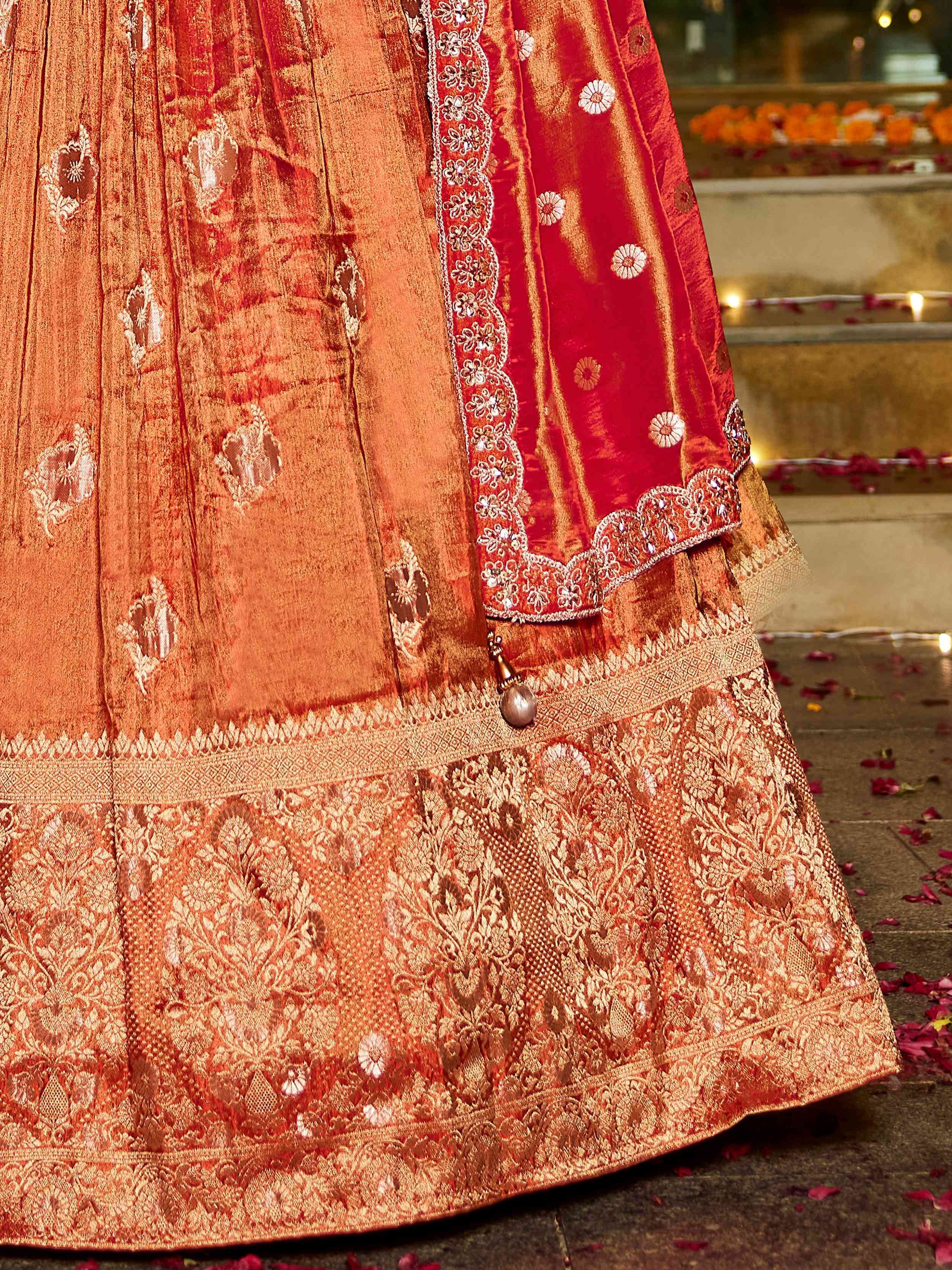 Attractive Orange Zari Weaving Tissue Engagement Wear Lehenga Choli