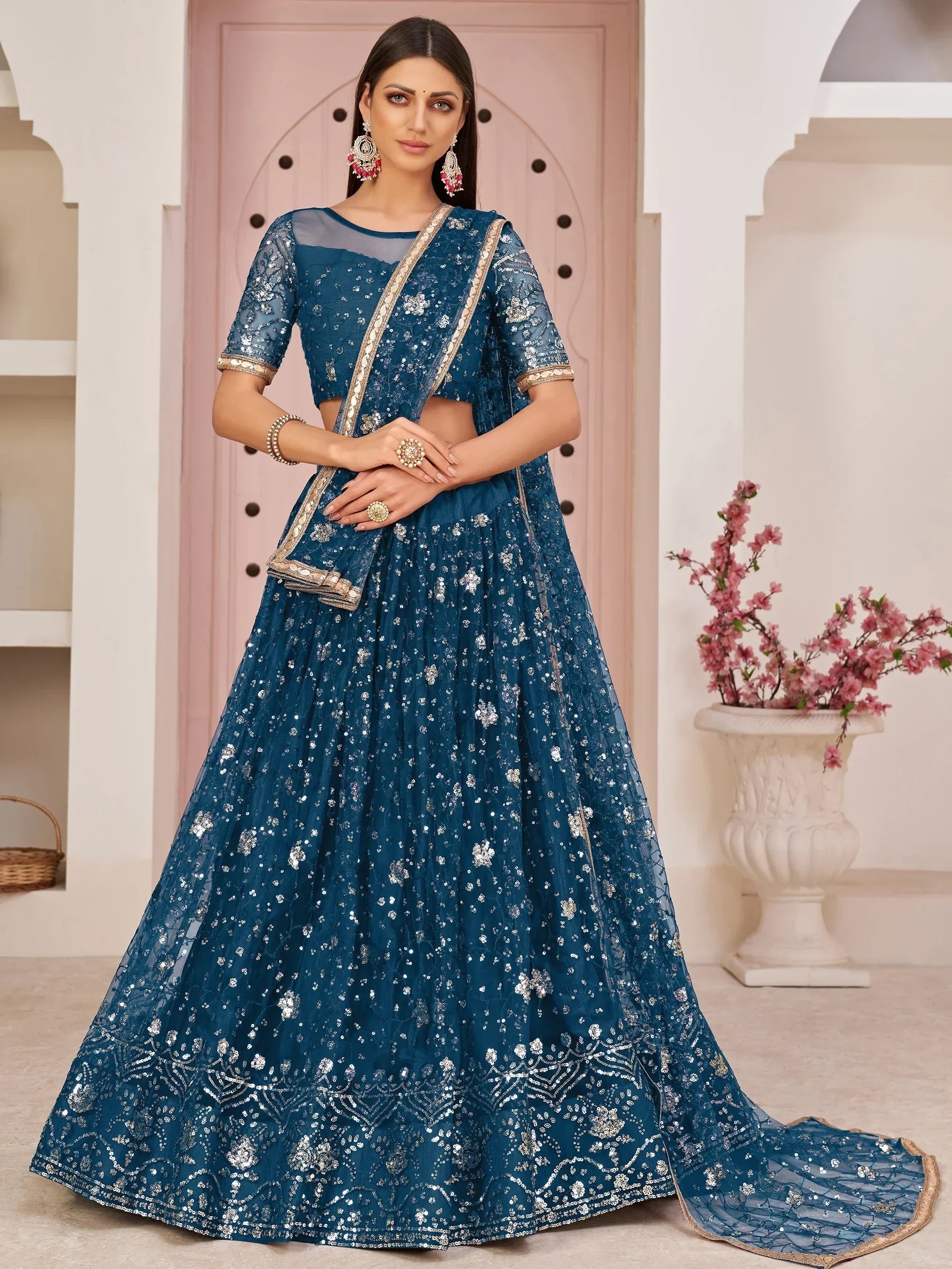 Blue Awesome Bottle Sequins Embroidered Net Lehenga Choli