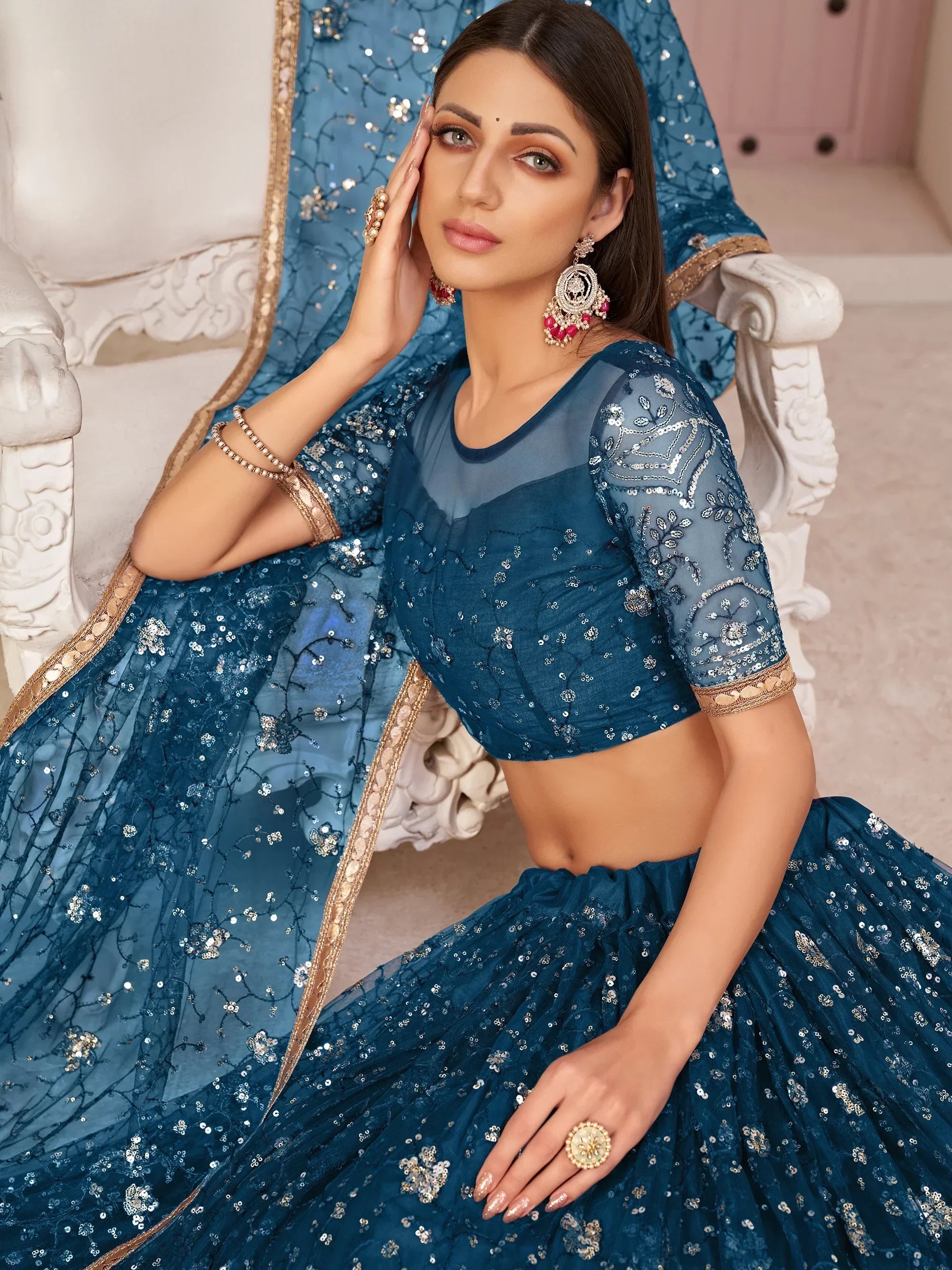 Blue Awesome Bottle Sequins Embroidered Net Lehenga Choli