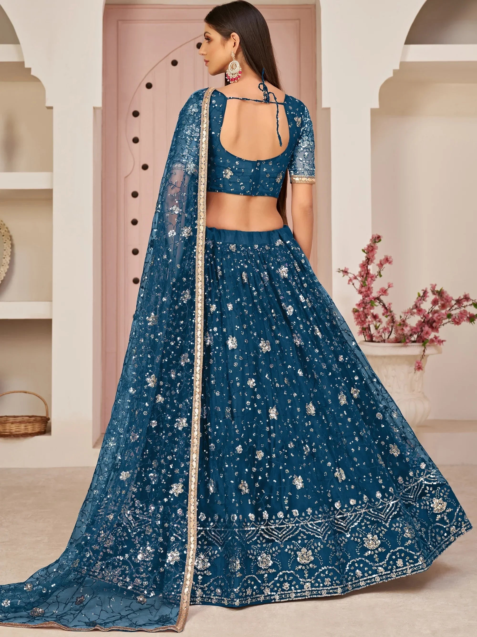 Blue Awesome Bottle Sequins Embroidered Net Lehenga Choli