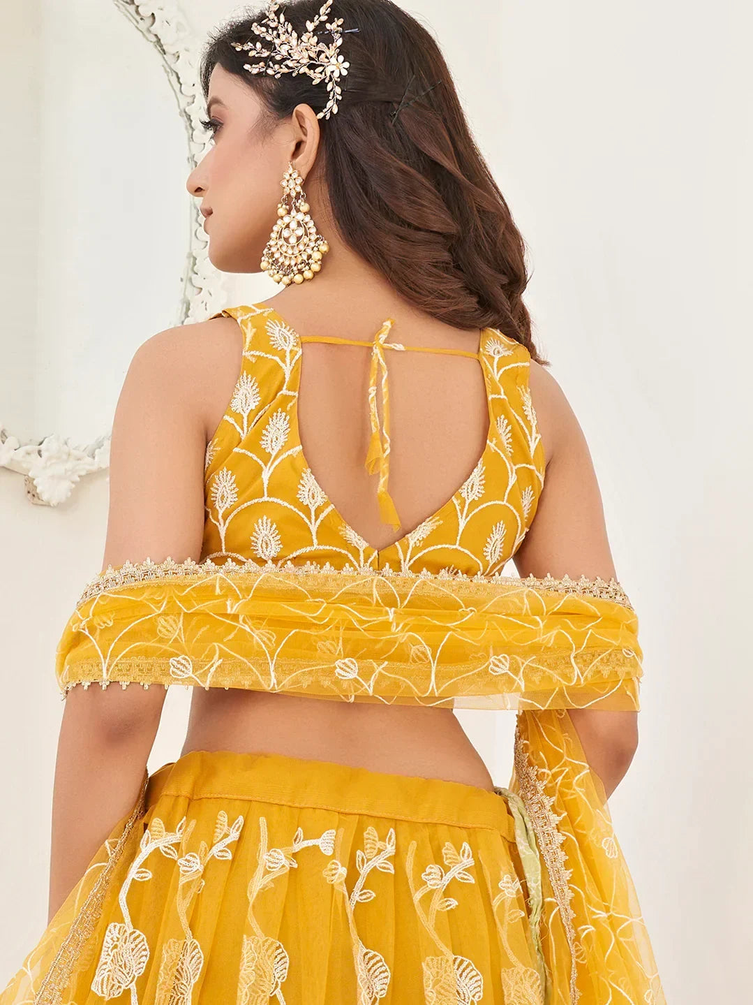 Mustard Appealing Embroidered Net Haldi Wear Lehenga Choli