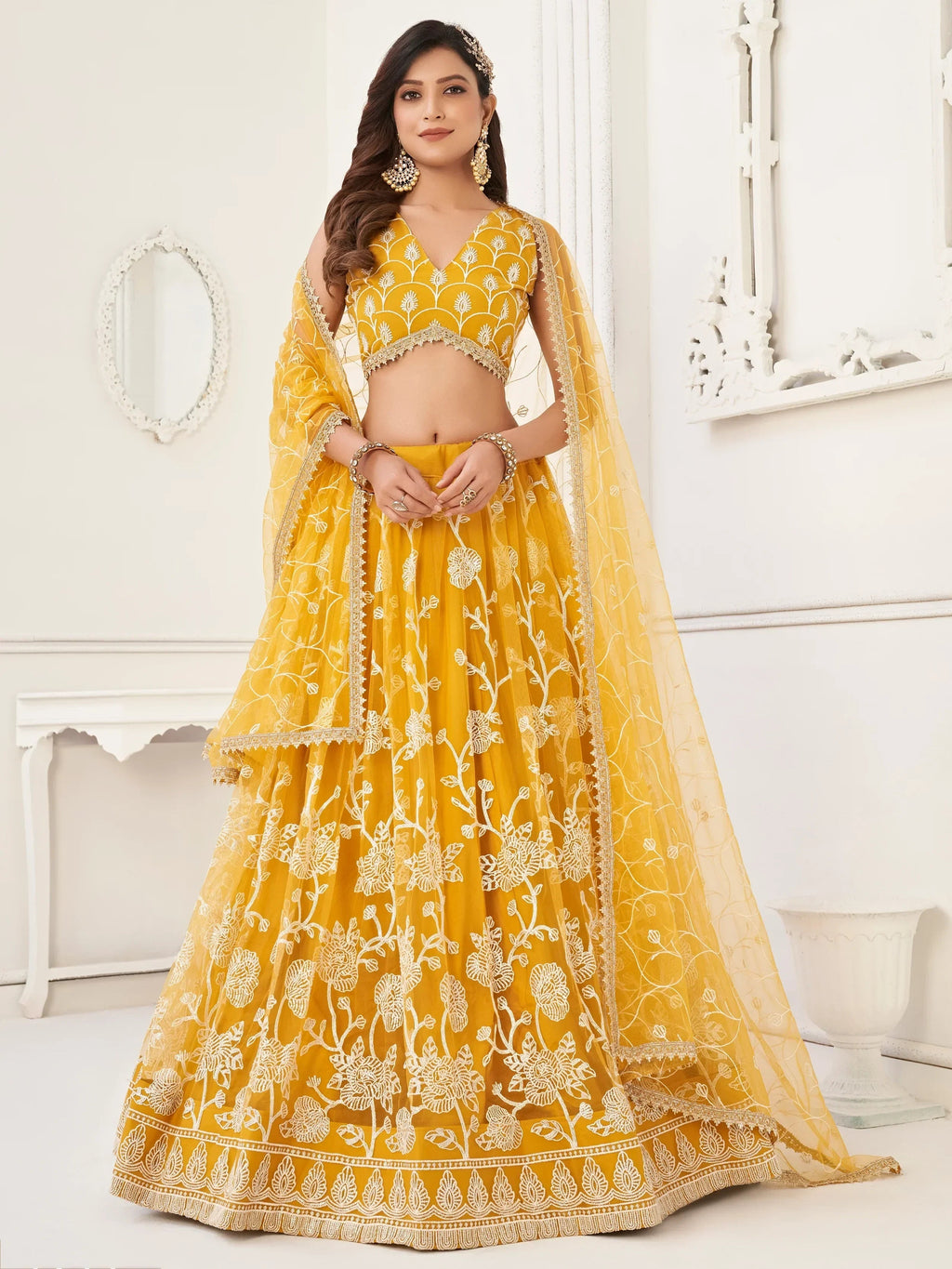 Mustard Appealing Embroidered Net Haldi Wear Lehenga Choli