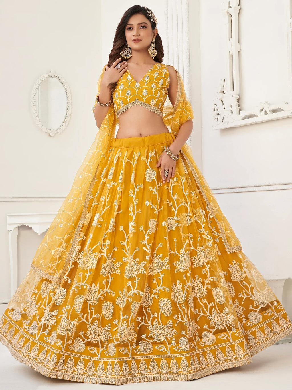Mustard Appealing Embroidered Net Haldi Wear Lehenga Choli
