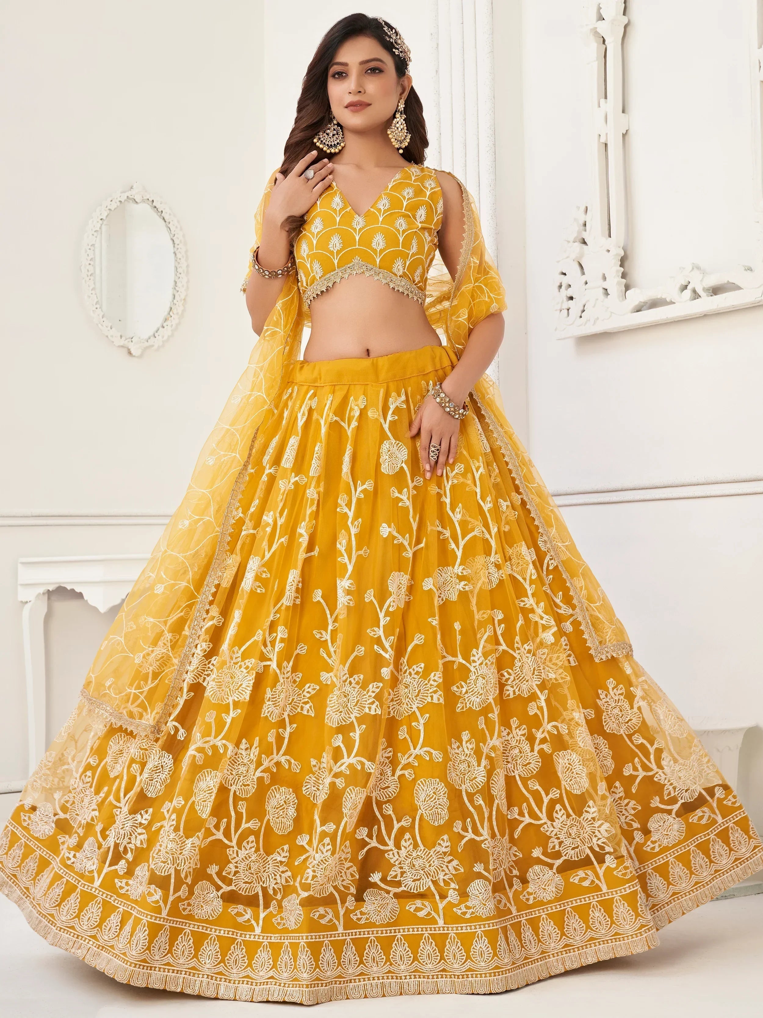 Mustard Appealing Embroidered Net Haldi Wear Lehenga Choli