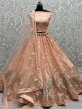 Peach Impressive Sequined Embroidery Wedding Wear Lehenga Choli