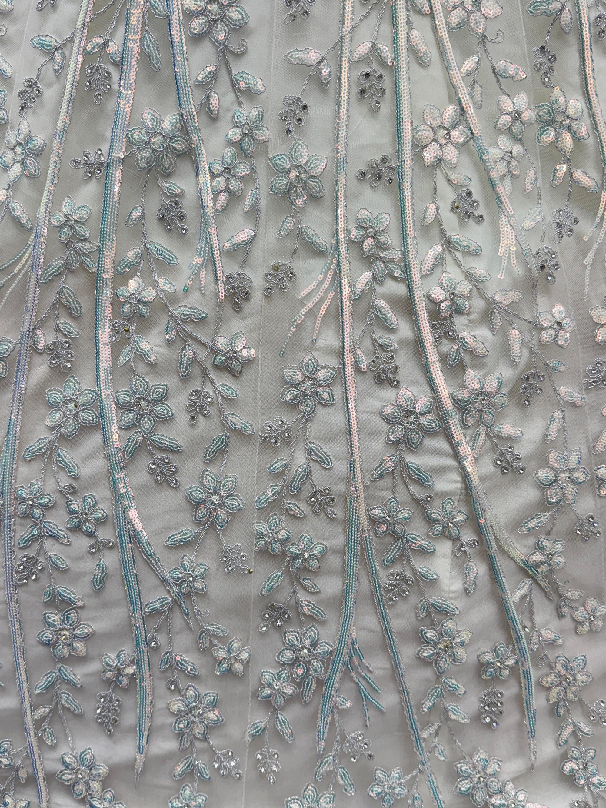 Beautiful White Sequins Embroidered Net Reception Wear Lehenga Choli