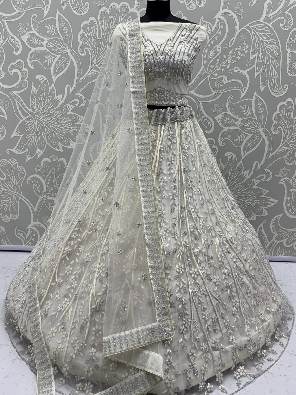 Beautiful White Sequins Embroidered Net Reception Wear Lehenga Choli
