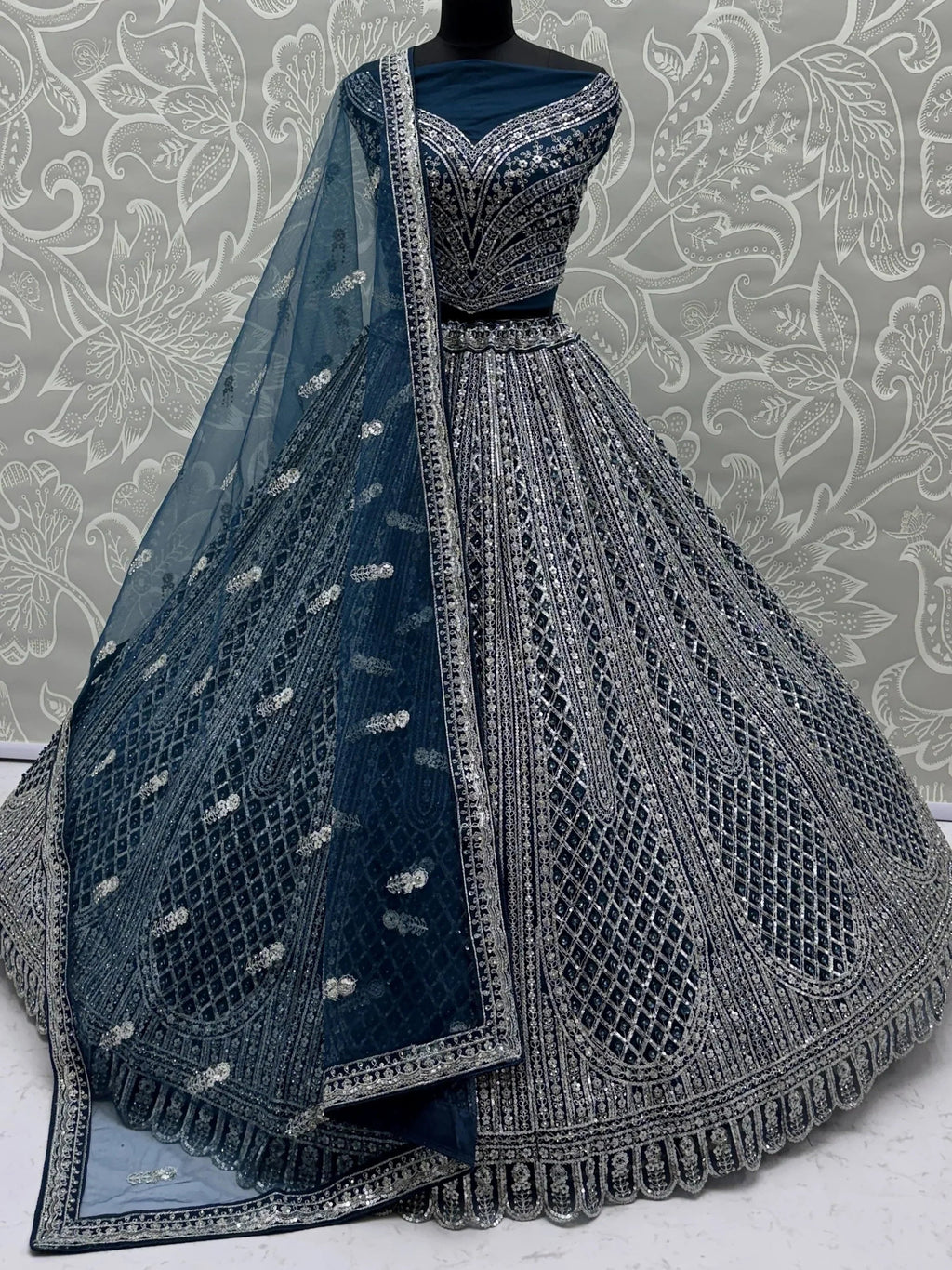 Blue Glamorous Sequins Embroidered Net Wedding Wear Lehenga Choli