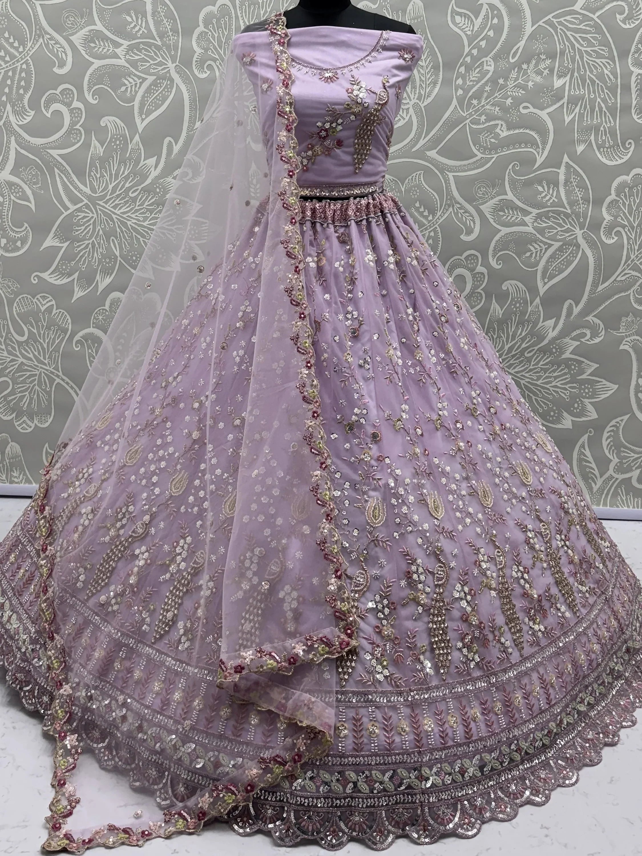 Lavender Gorgeous Embroidered Net Engagement Wear Lehenga Choli