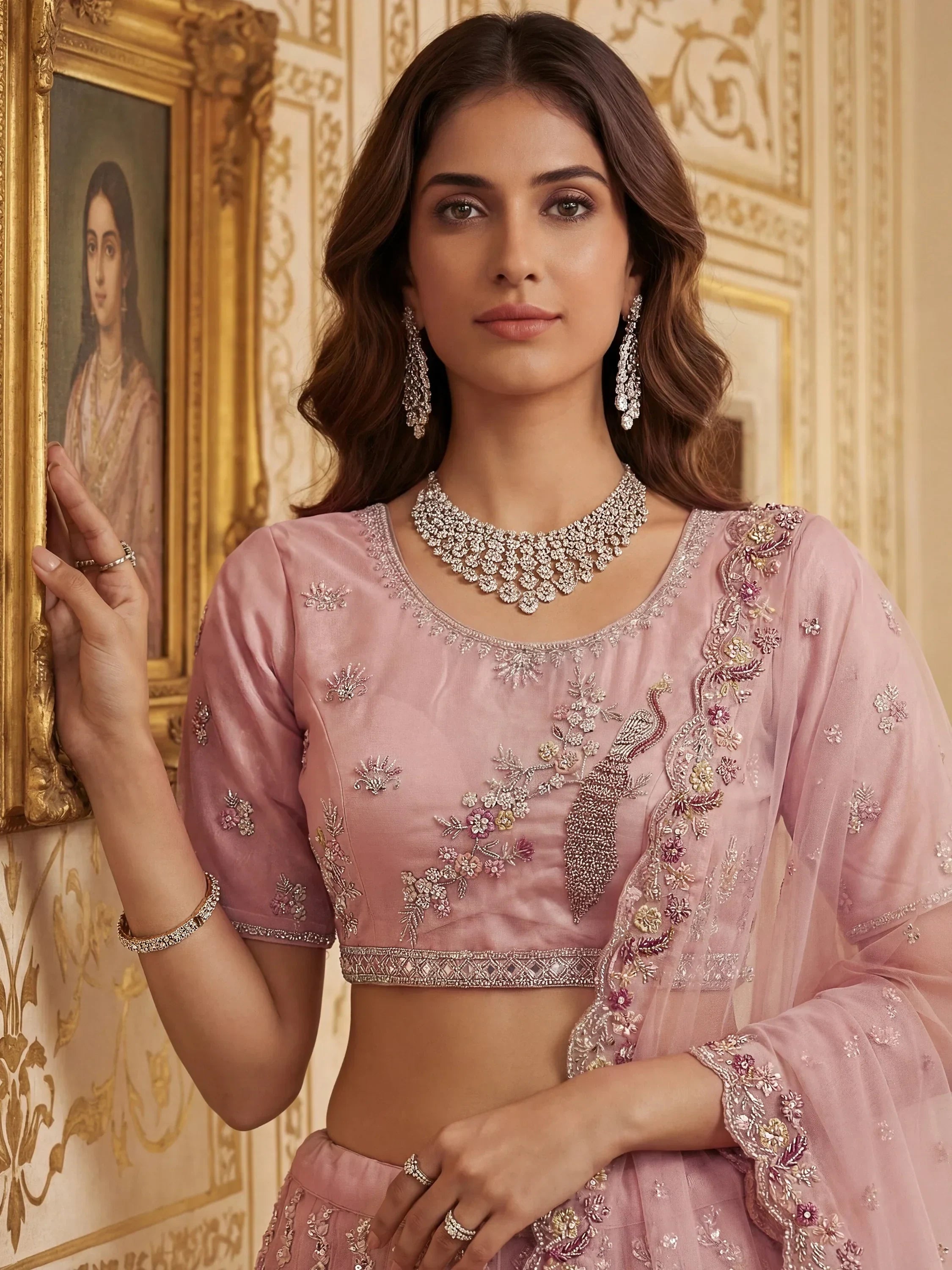 Peach Gorgeous Embroidered Net Engagement Wear Lehenga Choli