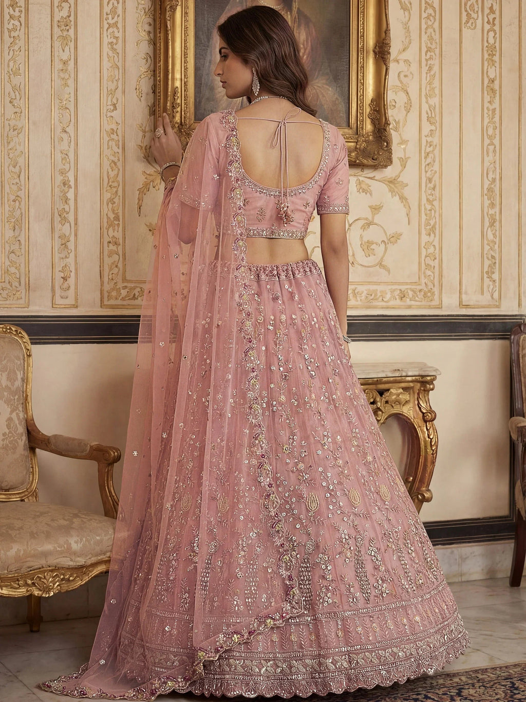 Peach Gorgeous Embroidered Net Engagement Wear Lehenga Choli
