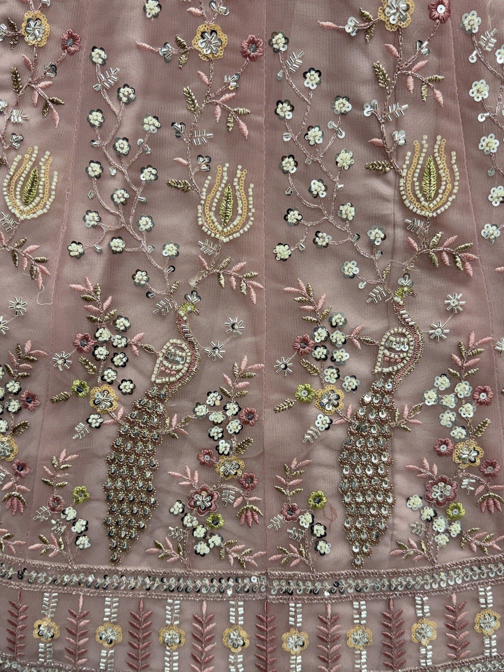 Peach Gorgeous Embroidered Net Engagement Wear Lehenga Choli
