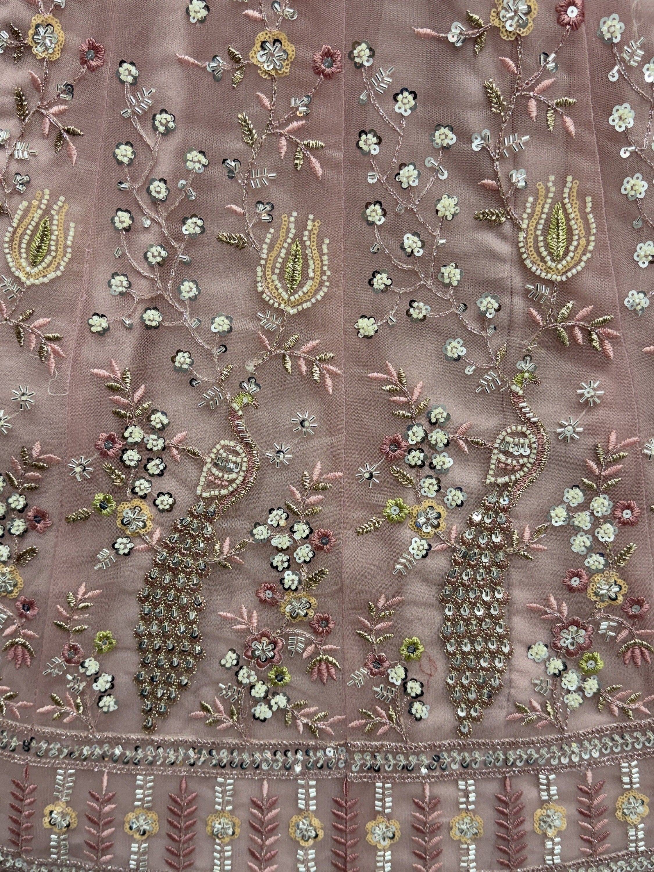 Peach Gorgeous Embroidered Net Engagement Wear Lehenga Choli