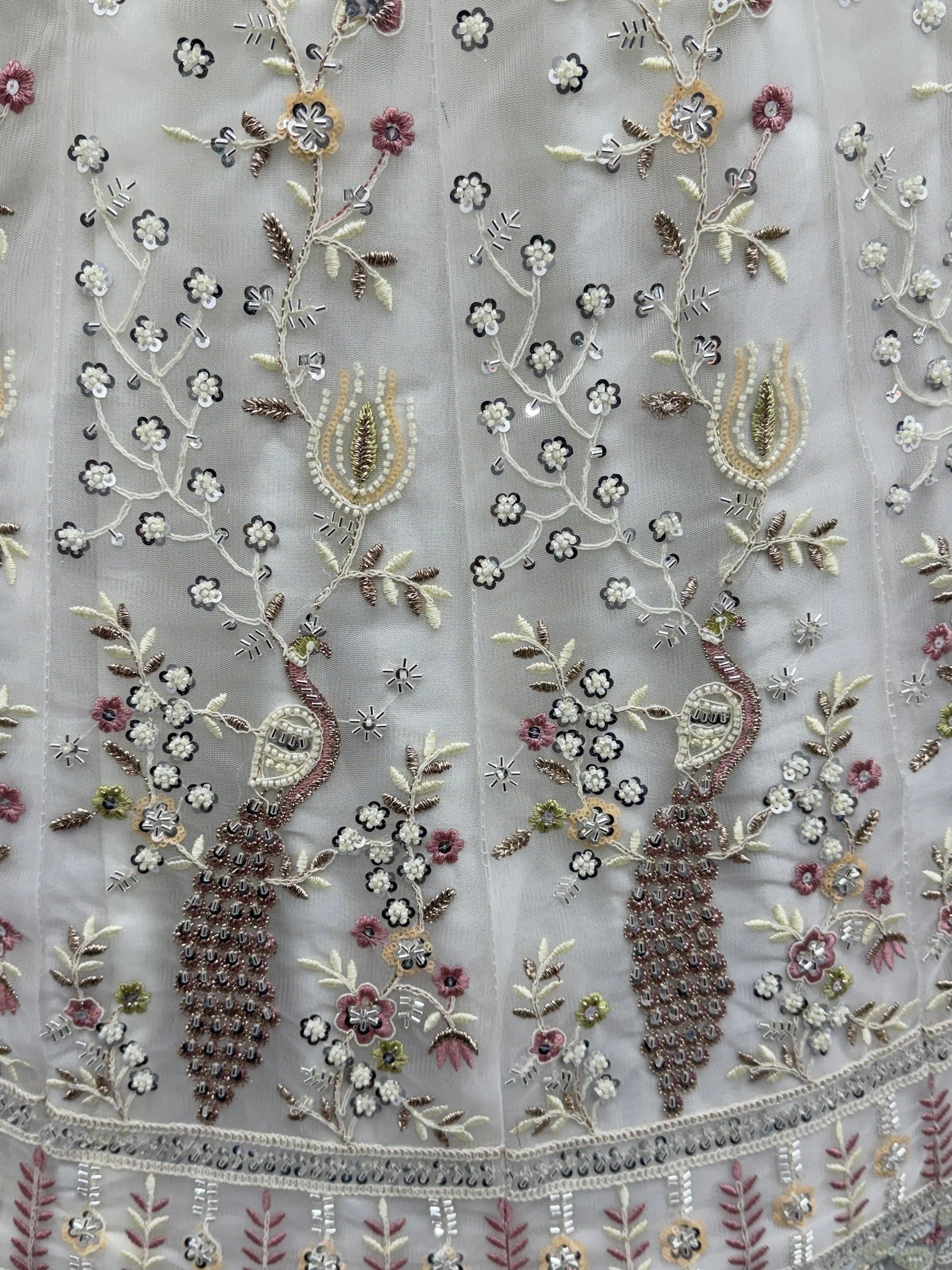Off White Gorgeous Embroidered Net Engagement Wear Lehenga Choli