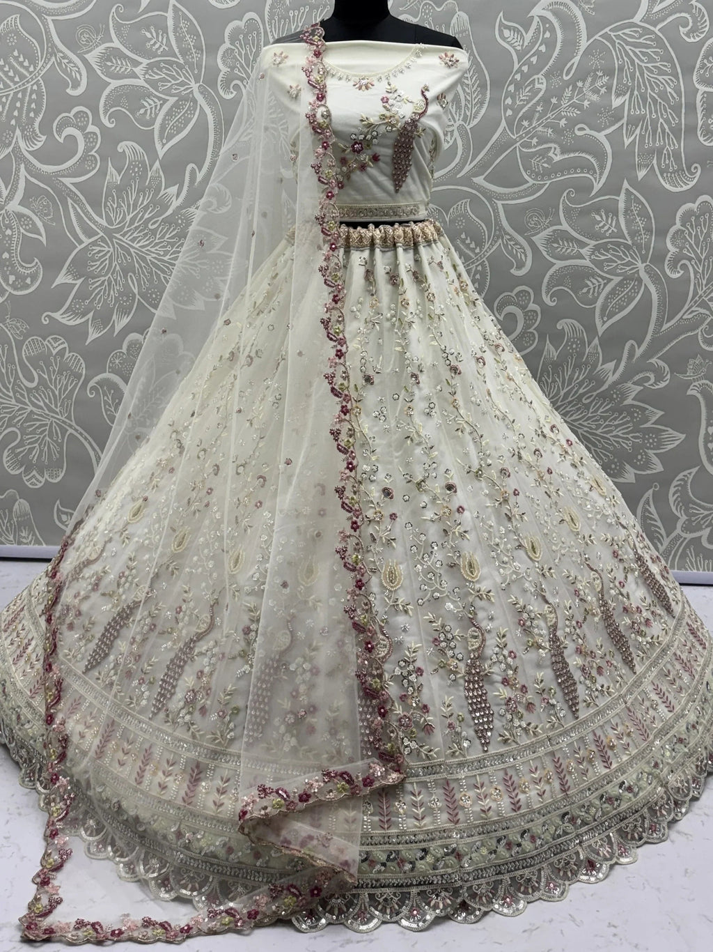 Off White Gorgeous Embroidered Net Engagement Wear Lehenga Choli