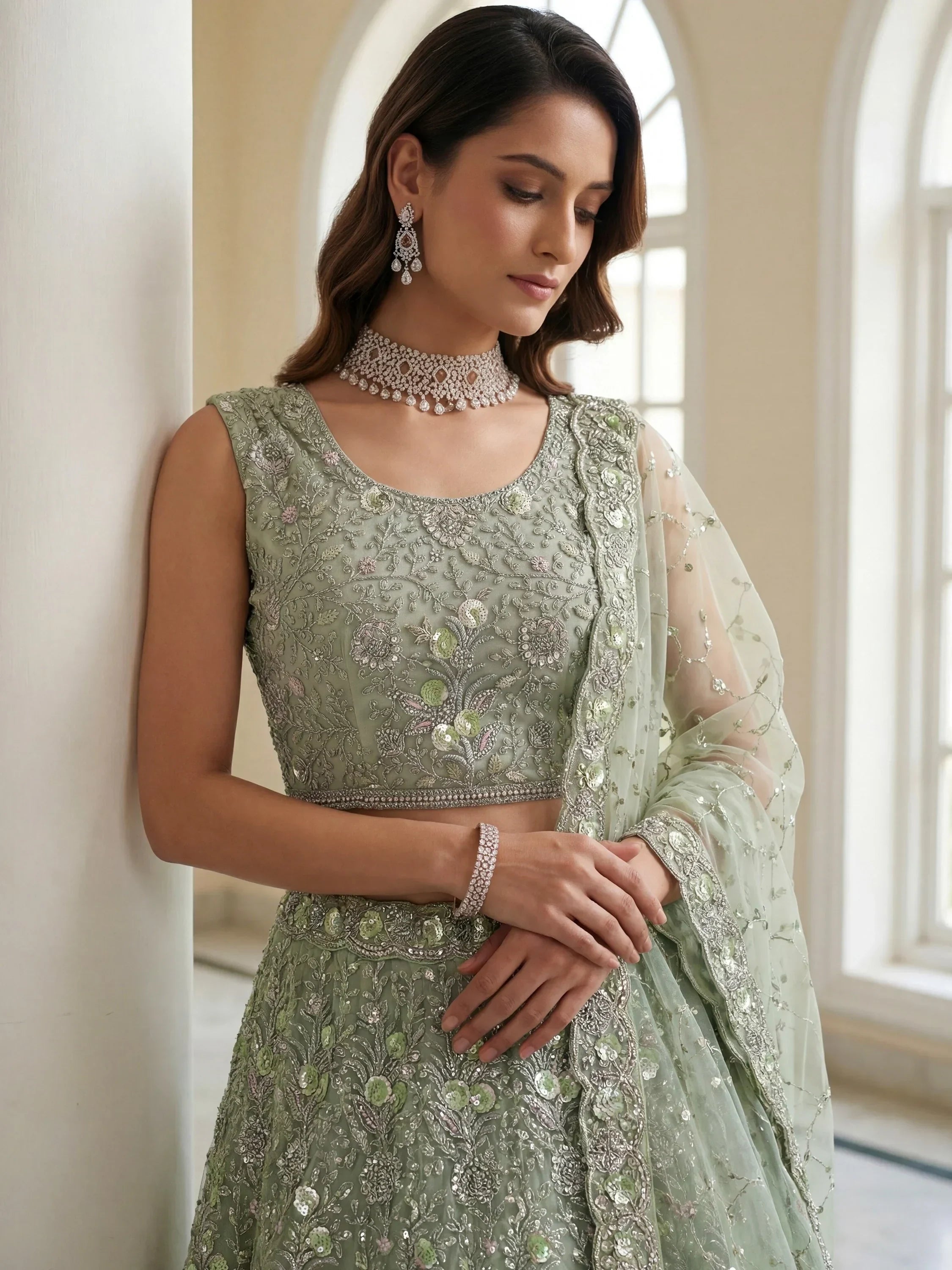 Beautiful Sea Green Embroidered Net Reception Wear Lehenga Choli