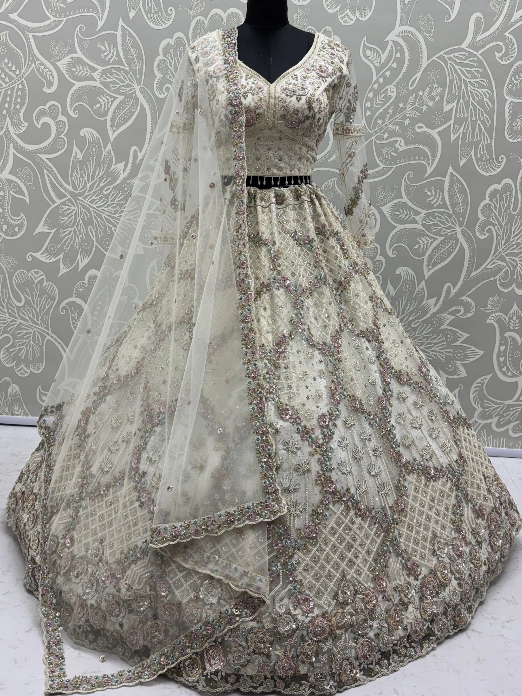 White Notable Multi Thread Work Net Reception Wear Lehenga With Blouse