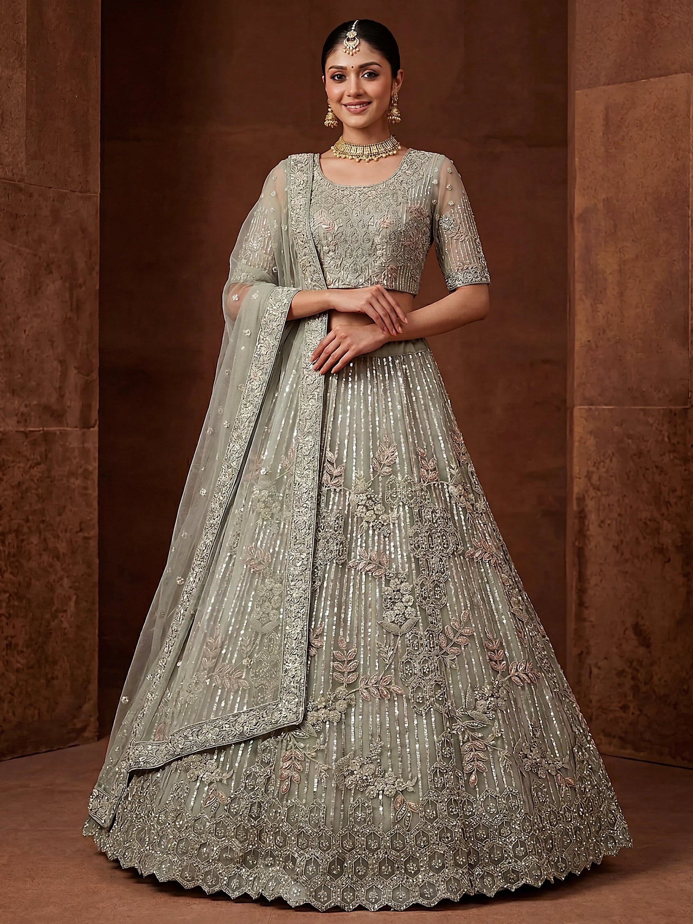 Green Breathtaking Zircon Work Net Bridesmaid Lehenga With Blouse