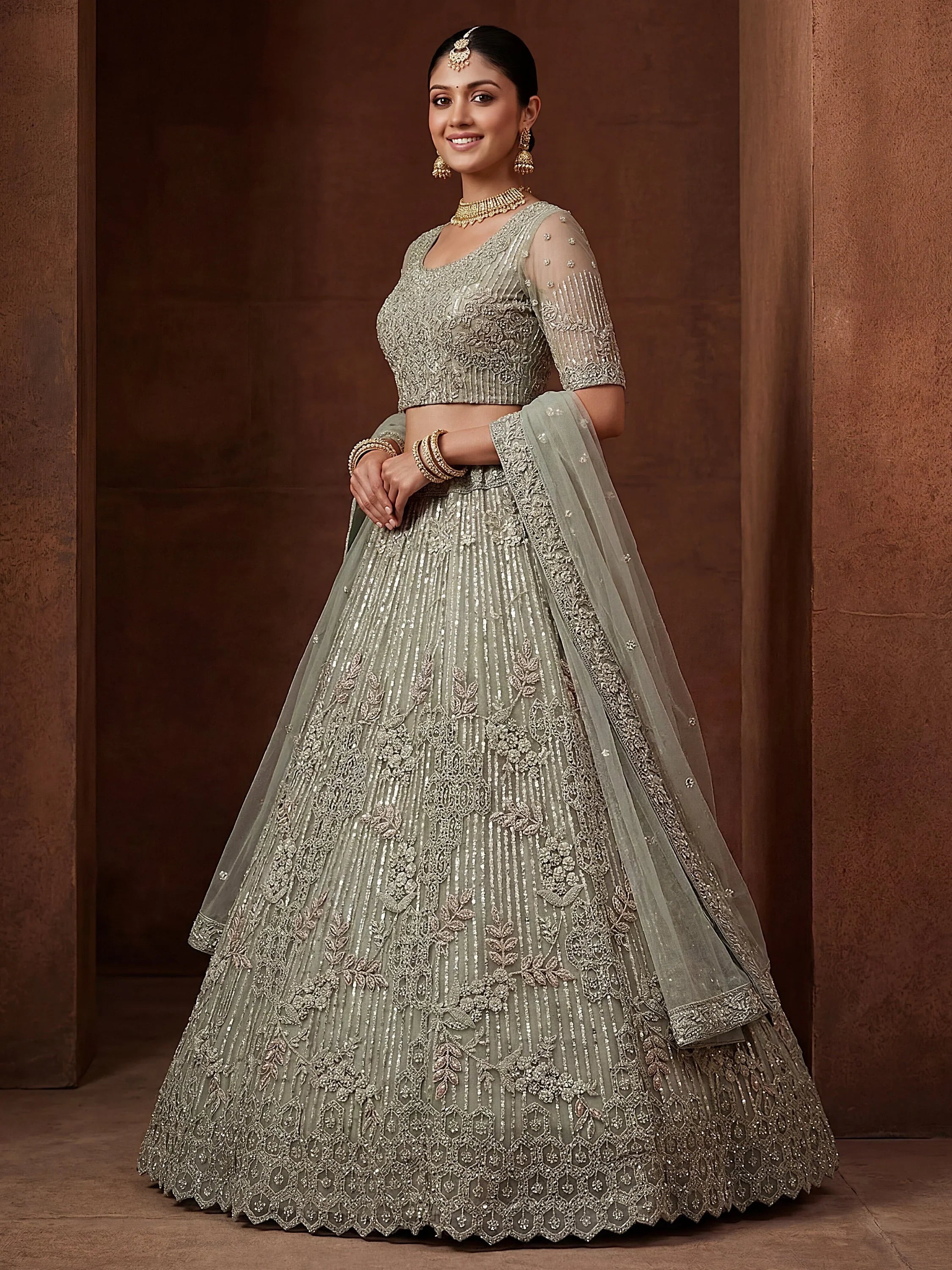 Green Breathtaking Zircon Work Net Bridesmaid Lehenga With Blouse