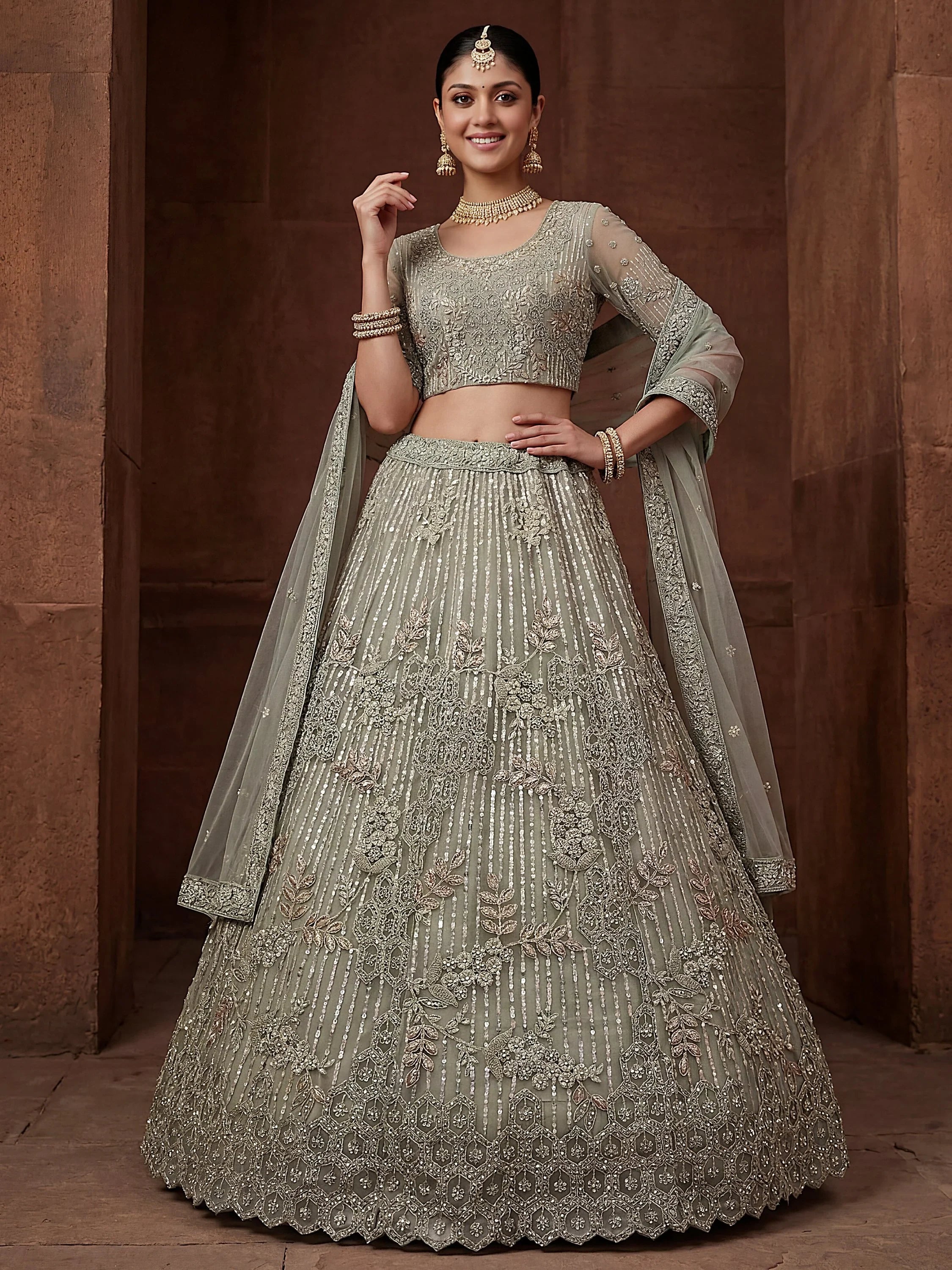 Green Breathtaking Zircon Work Net Bridesmaid Lehenga With Blouse