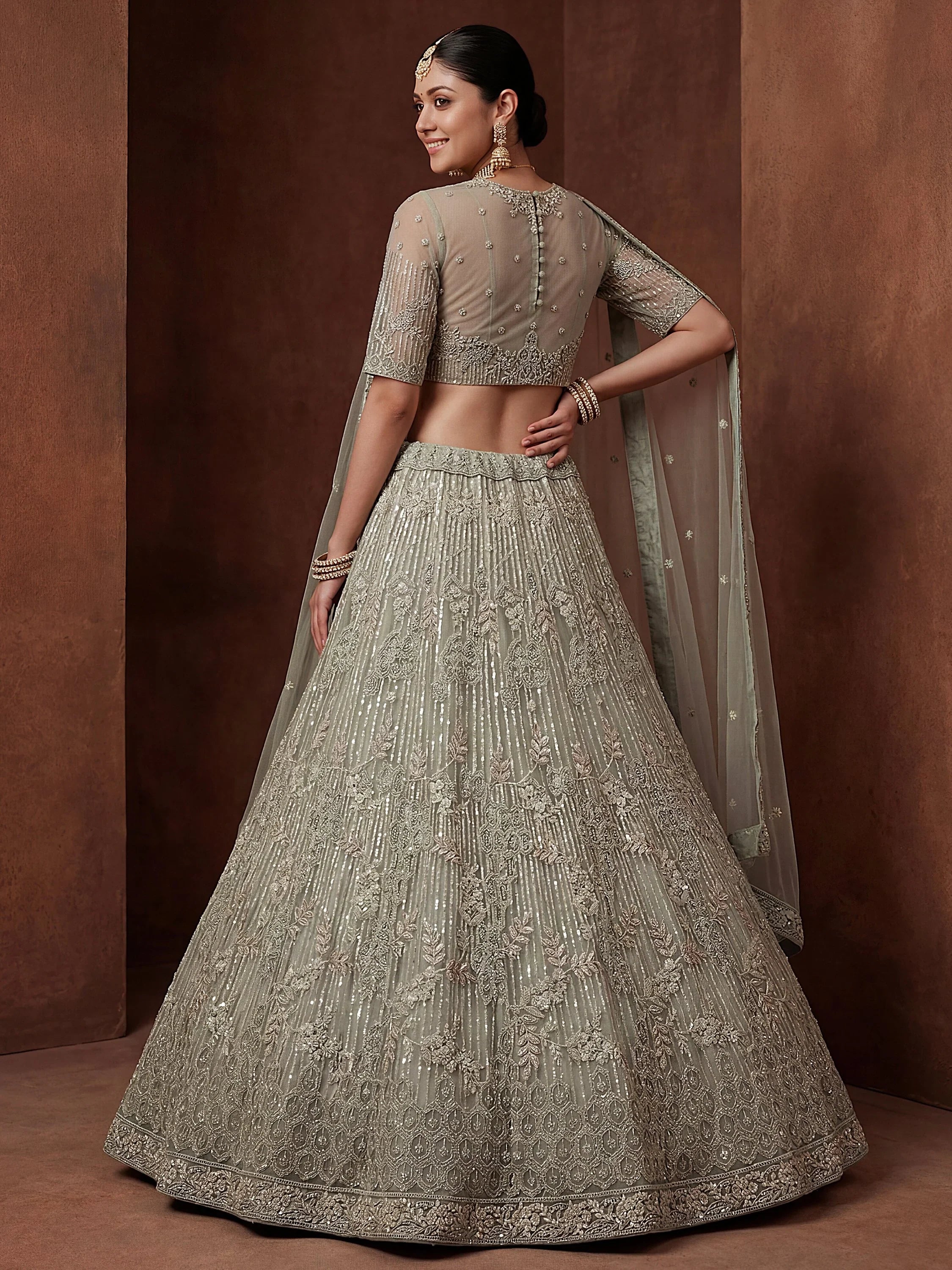 Green Breathtaking Zircon Work Net Bridesmaid Lehenga With Blouse