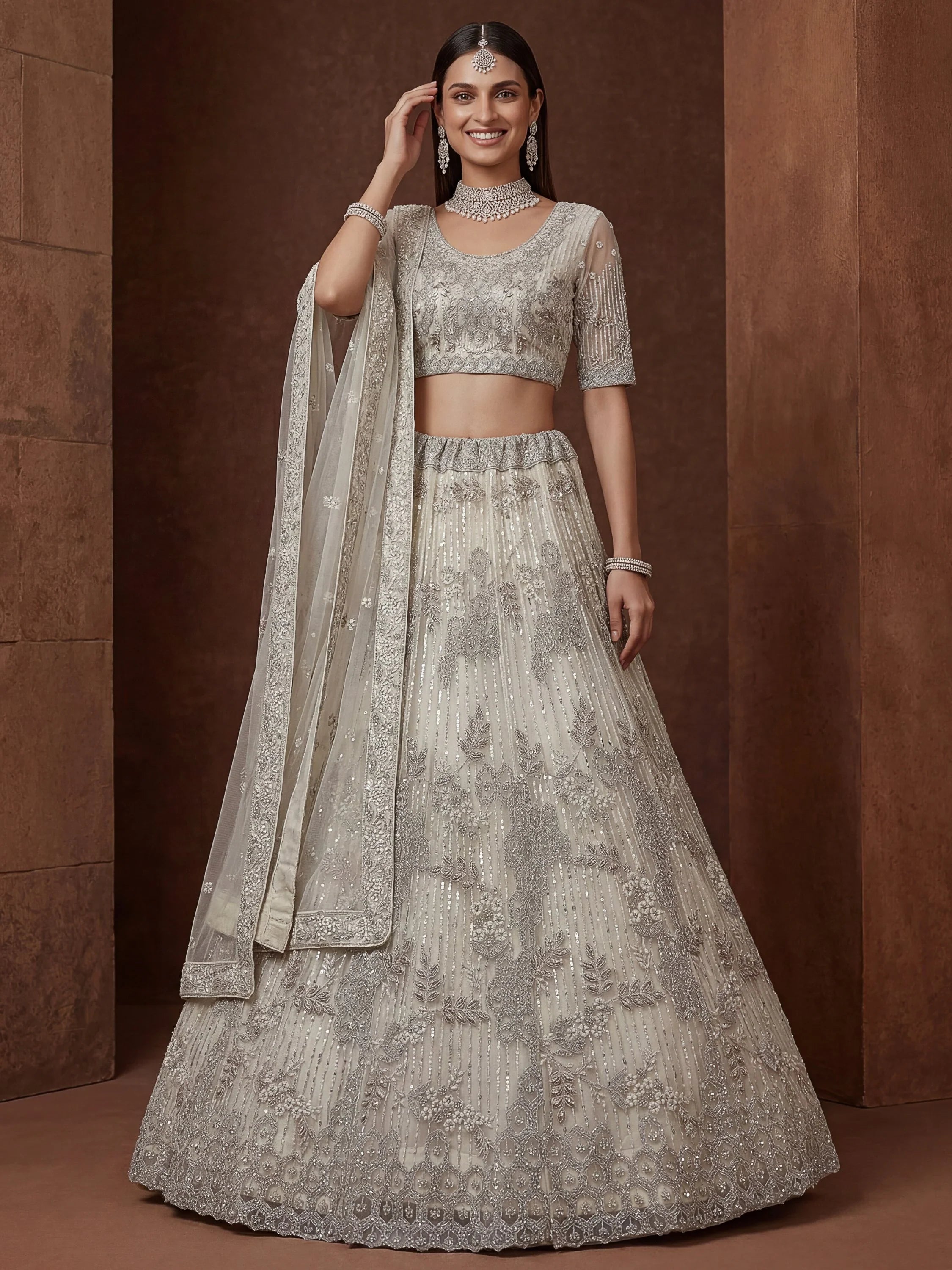 Cream Breathtaking Zircon Work Net Bridesmaid Lehenga With Blouse