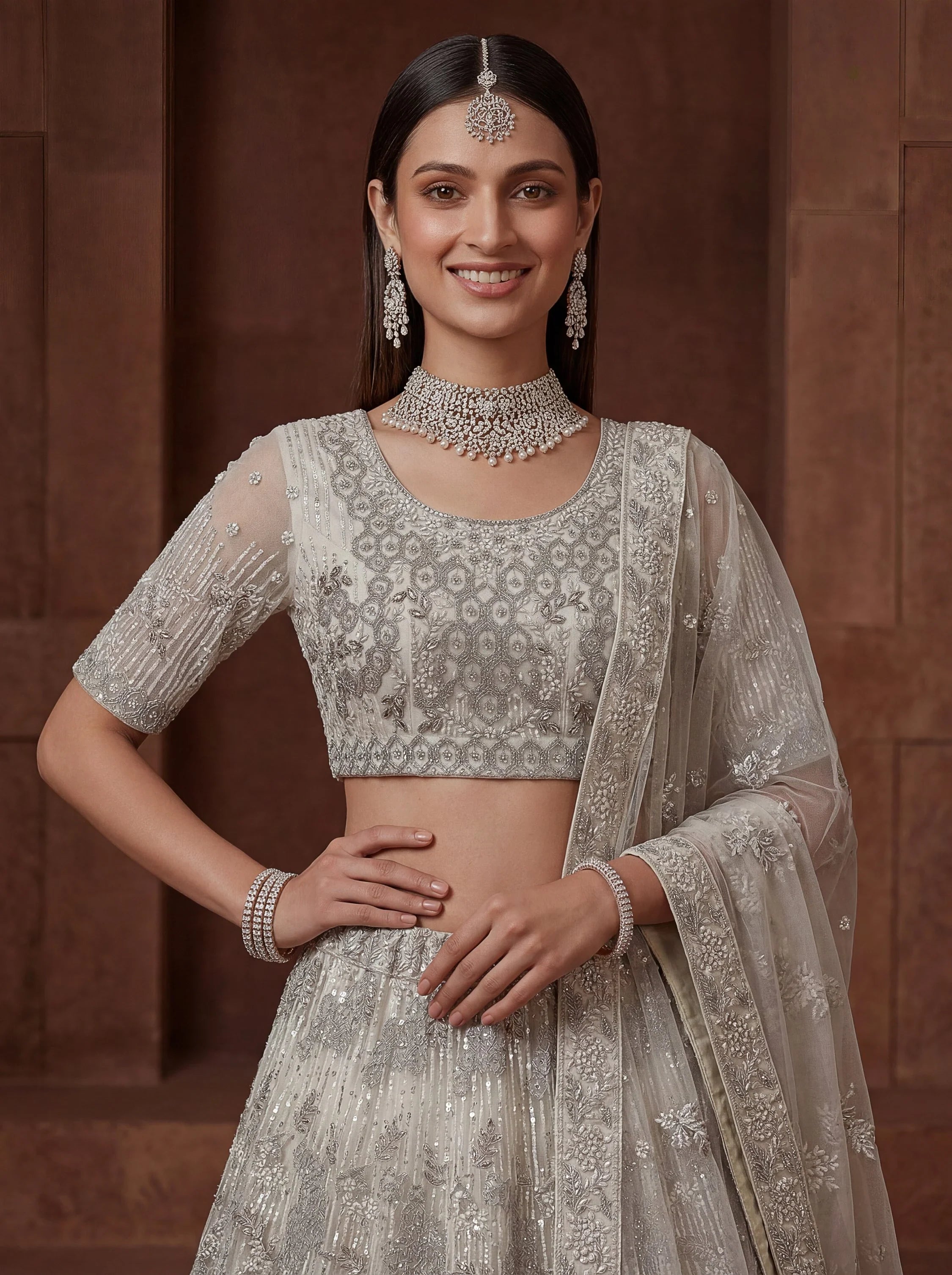 Cream Breathtaking Zircon Work Net Bridesmaid Lehenga With Blouse