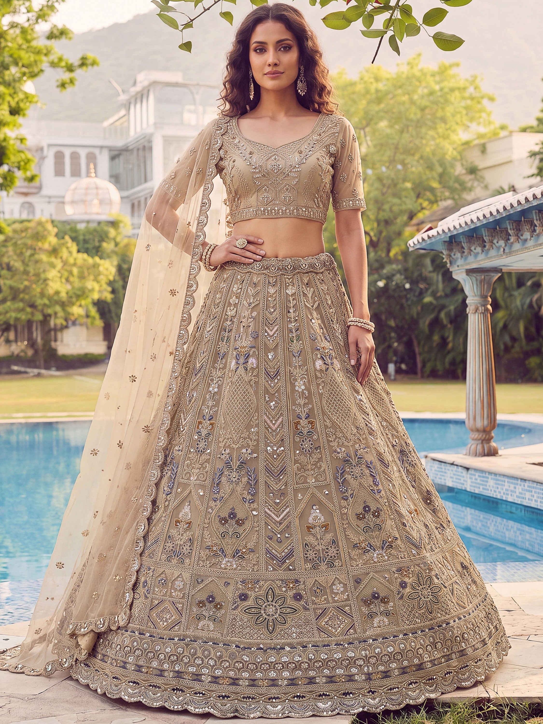 Beige Shiny Embroidered Net Reception Wear Lehenga Choli With Dupatta