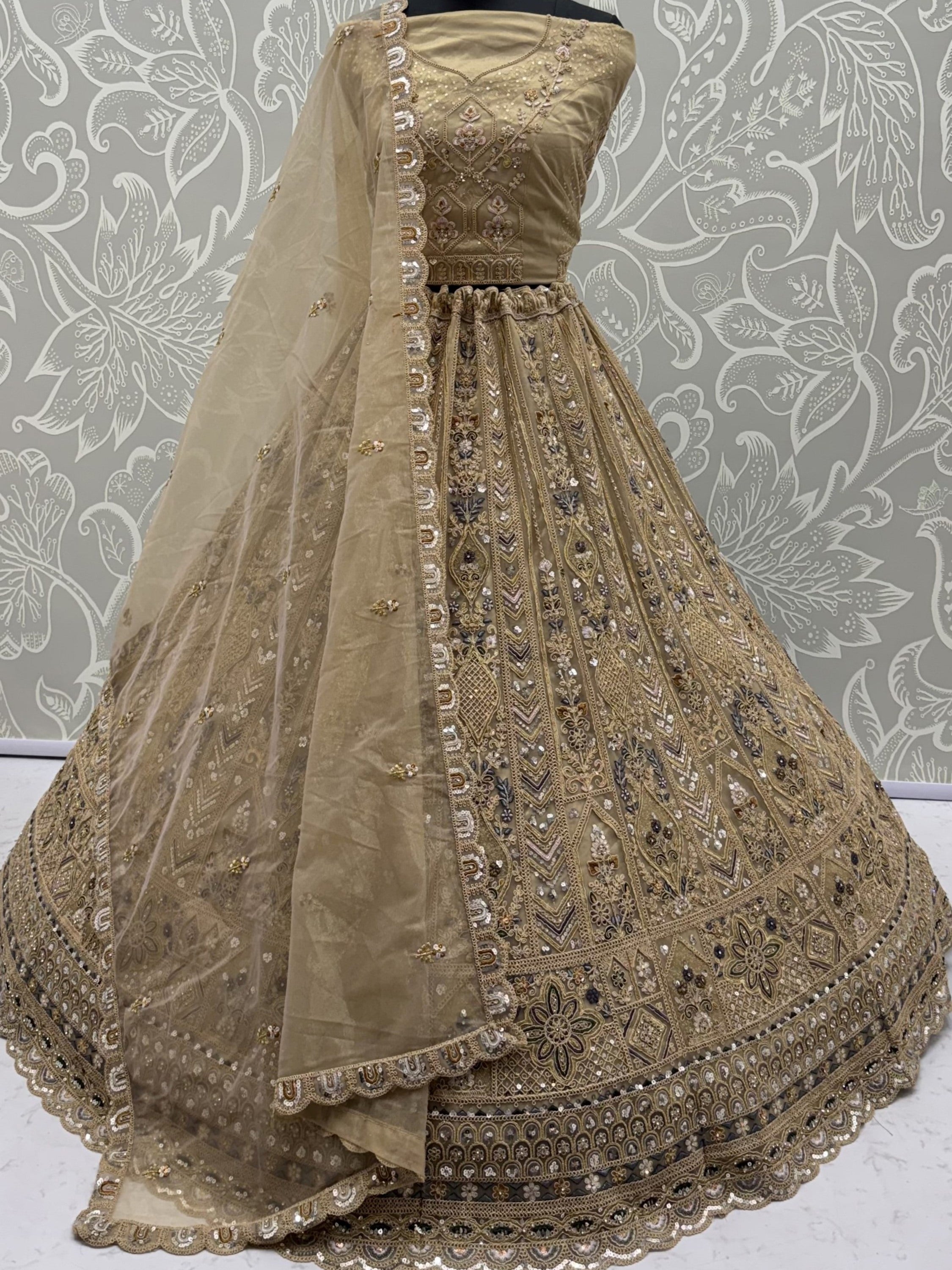 Beige Shiny Embroidered Net Reception Wear Lehenga Choli With Dupatta