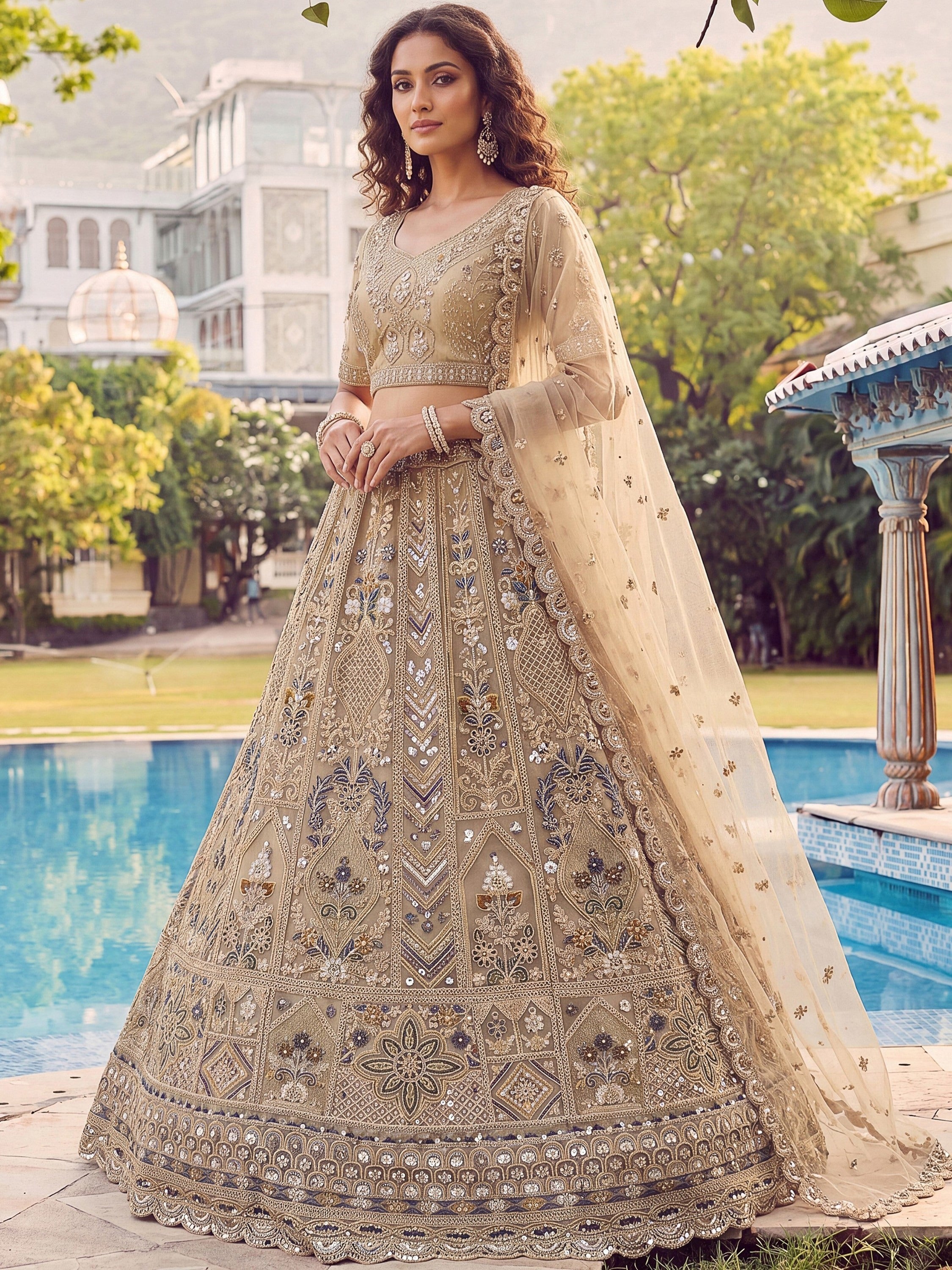 Beige Shiny Embroidered Net Reception Wear Lehenga Choli With Dupatta