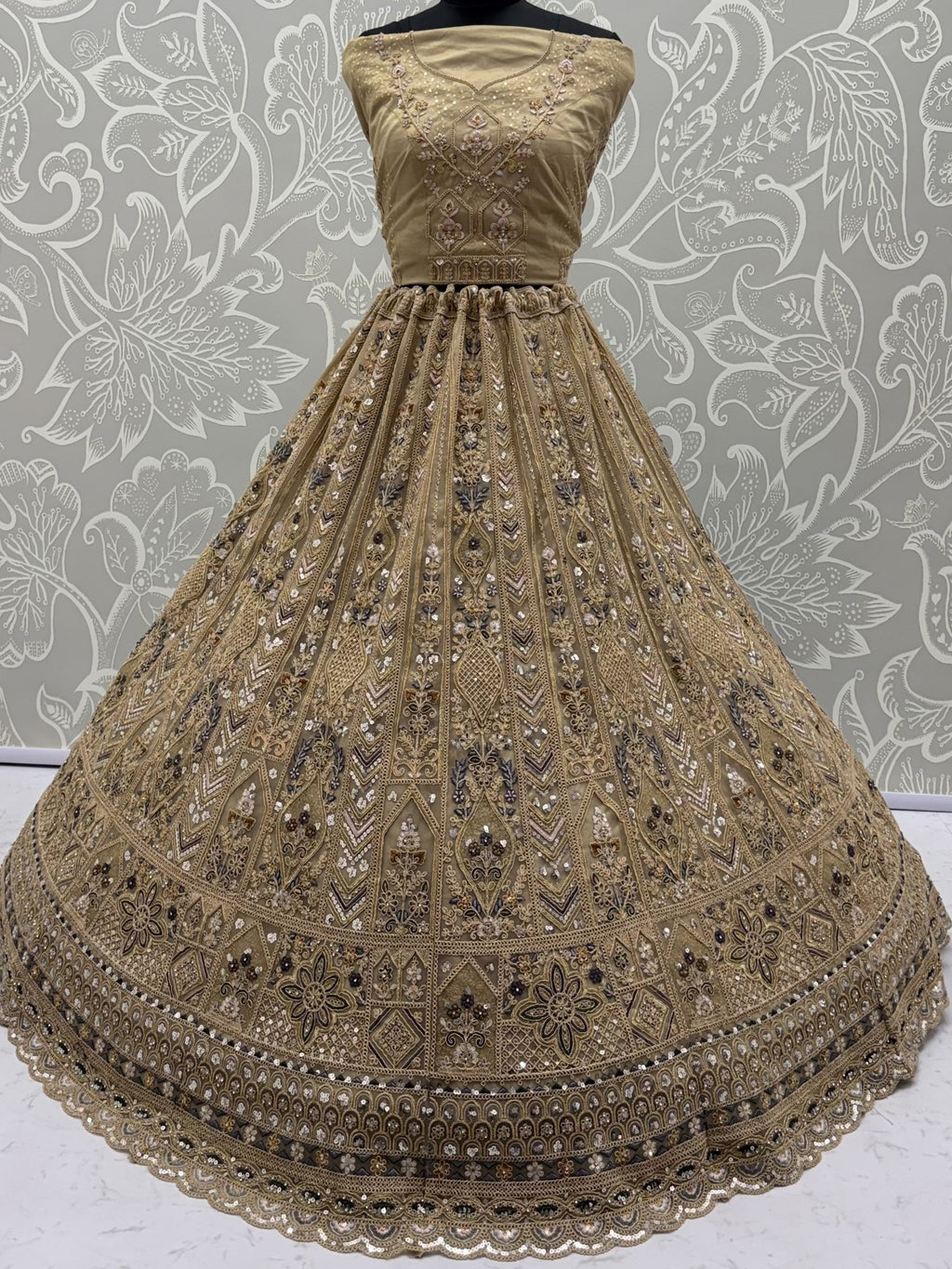 Beige Shiny Embroidered Net Reception Wear Lehenga Choli With Dupatta