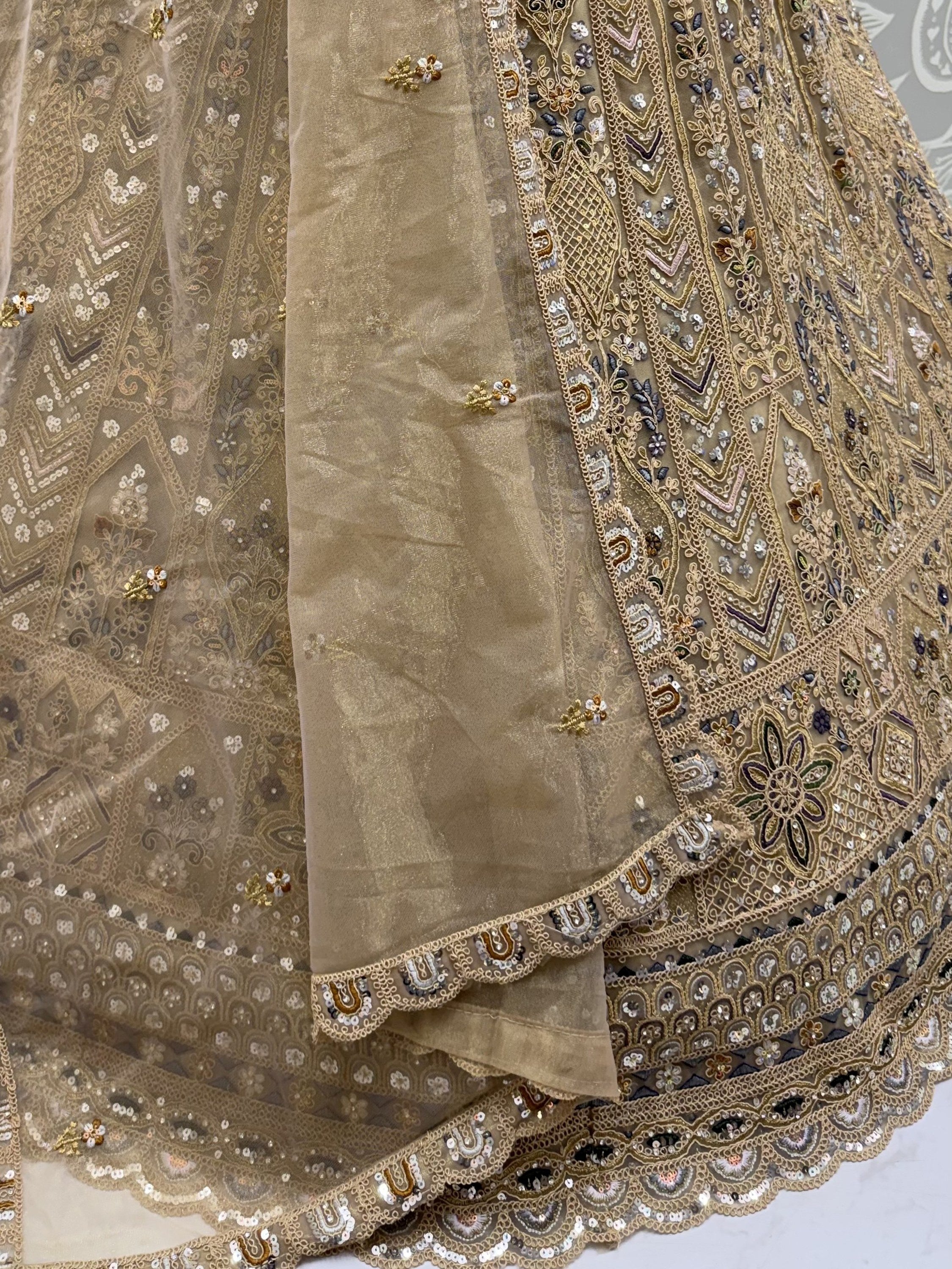 Beige Shiny Embroidered Net Reception Wear Lehenga Choli With Dupatta