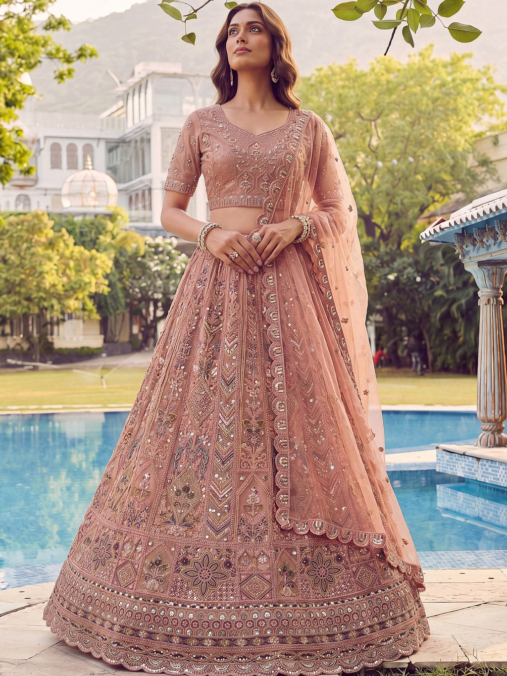 Peach Shiny Embroidered Net Reception Wear Lehenga Choli With Dupatta