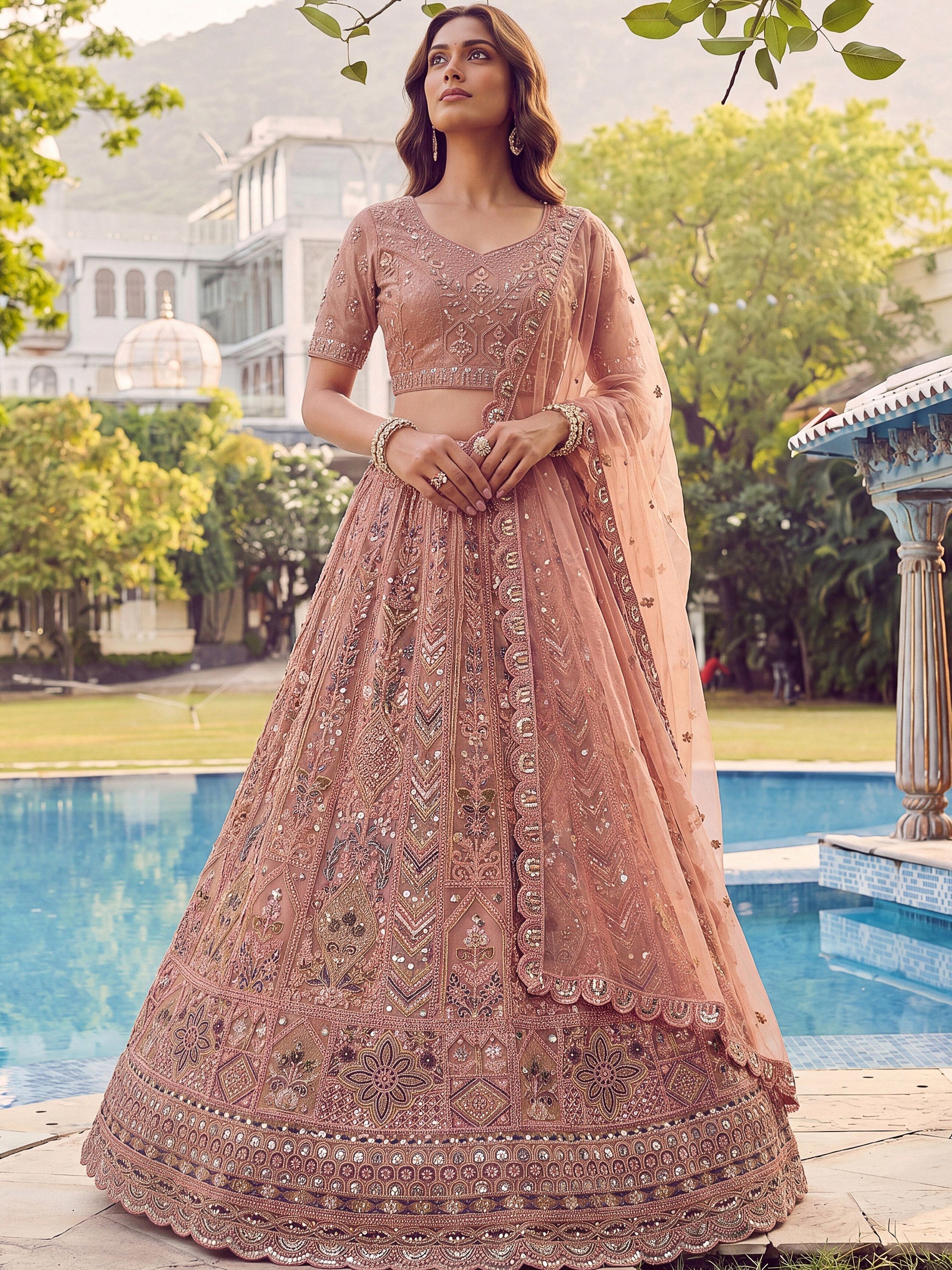 Peach Shiny Embroidered Net Reception Wear Lehenga Choli With Dupatta