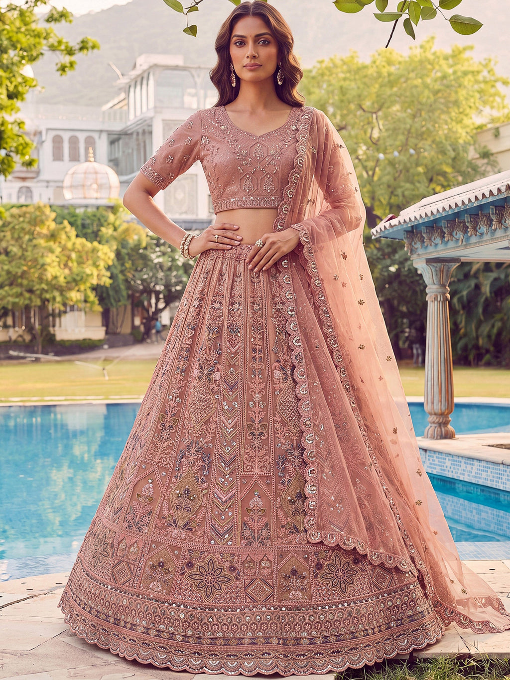 Peach Shiny Embroidered Net Reception Wear Lehenga Choli With Dupatta