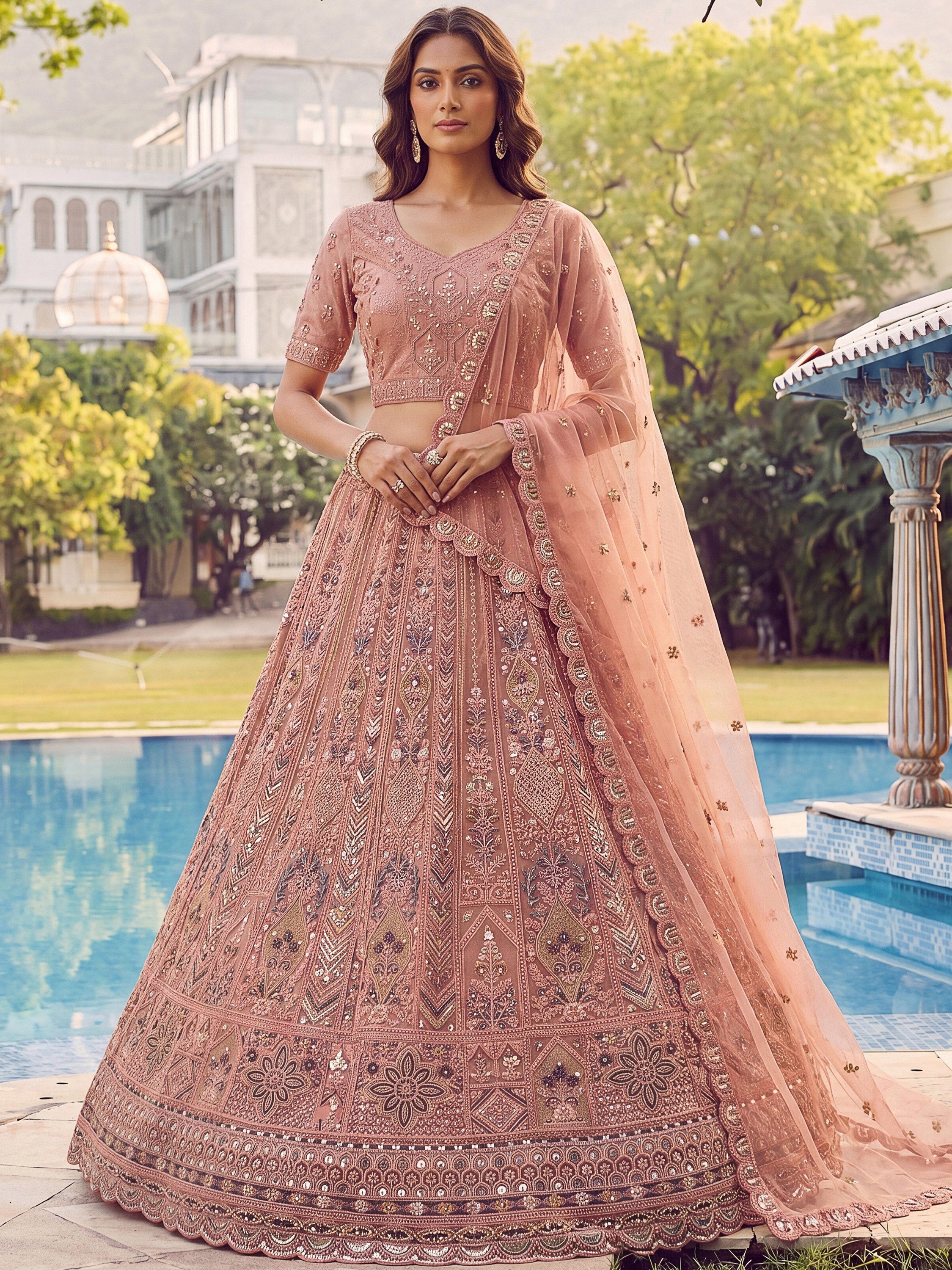 Peach Shiny Embroidered Net Reception Wear Lehenga Choli With Dupatta