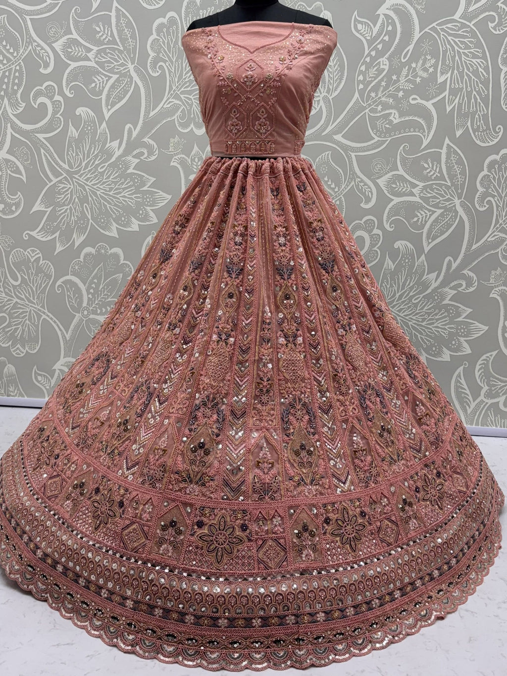 Peach Shiny Embroidered Net Reception Wear Lehenga Choli With Dupatta