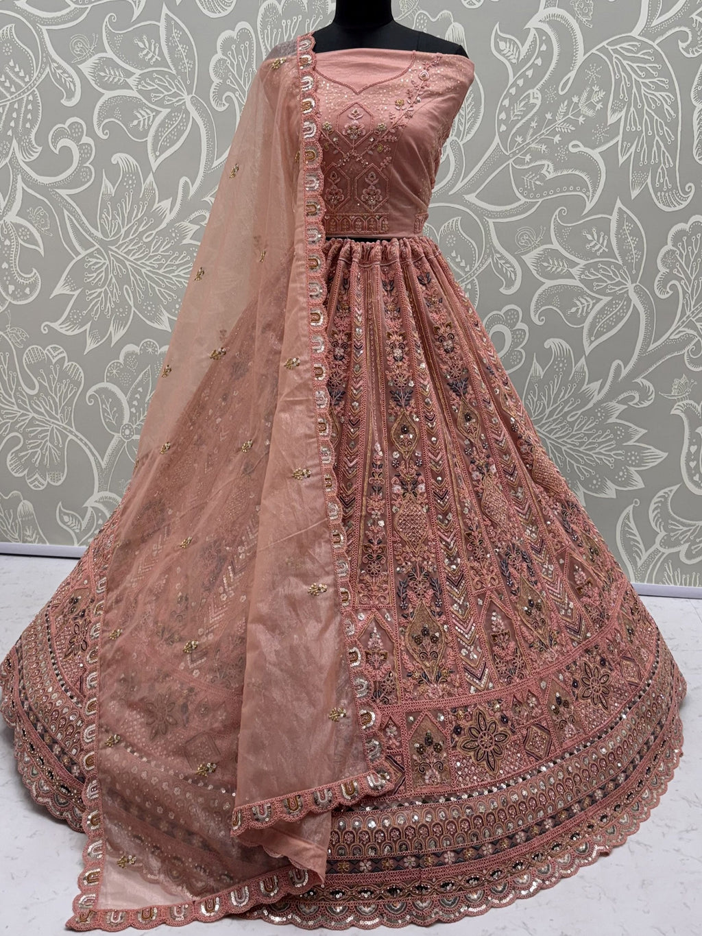 Peach Shiny Embroidered Net Reception Wear Lehenga Choli With Dupatta