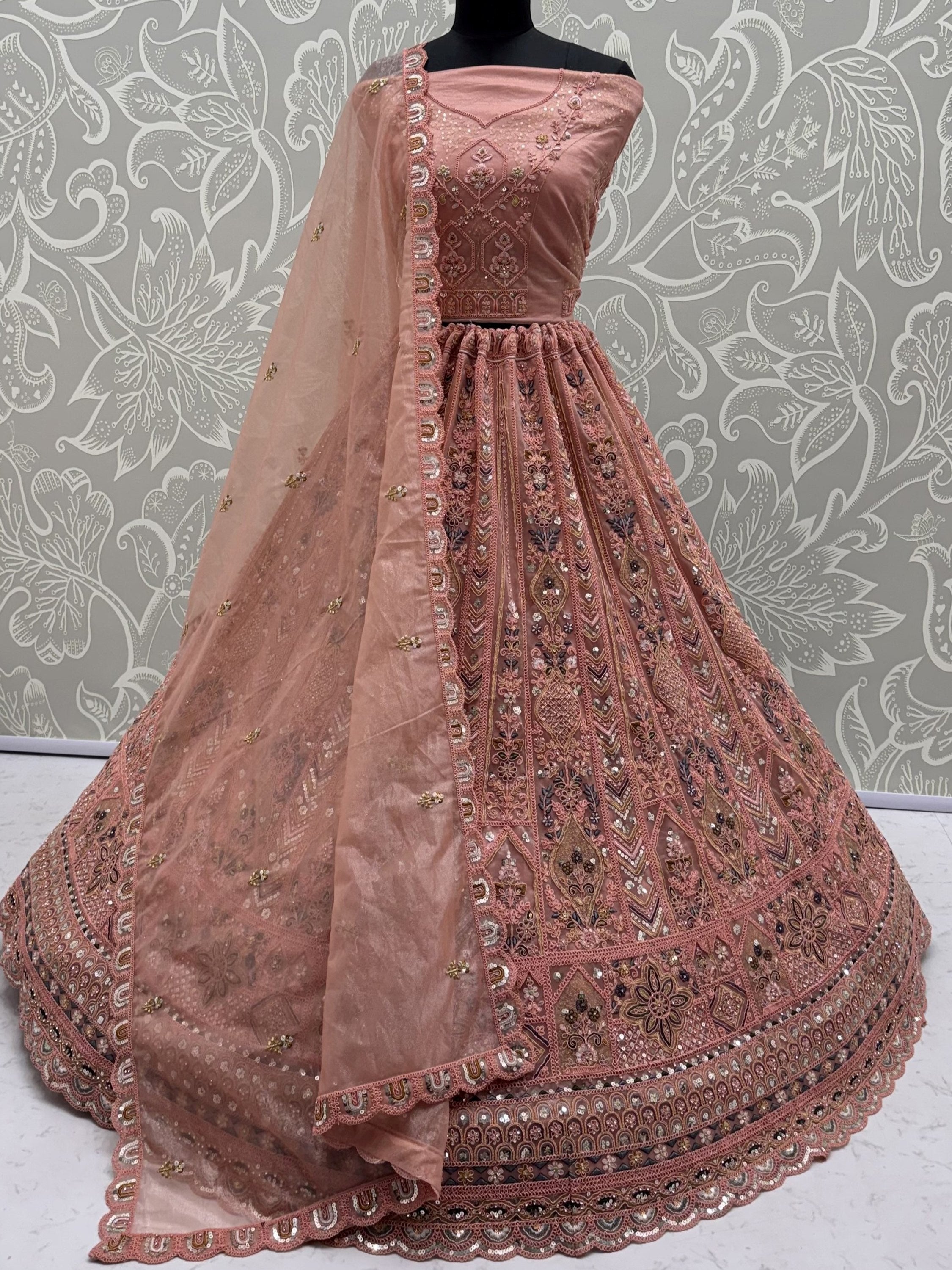 Peach Shiny Embroidered Net Reception Wear Lehenga Choli With Dupatta