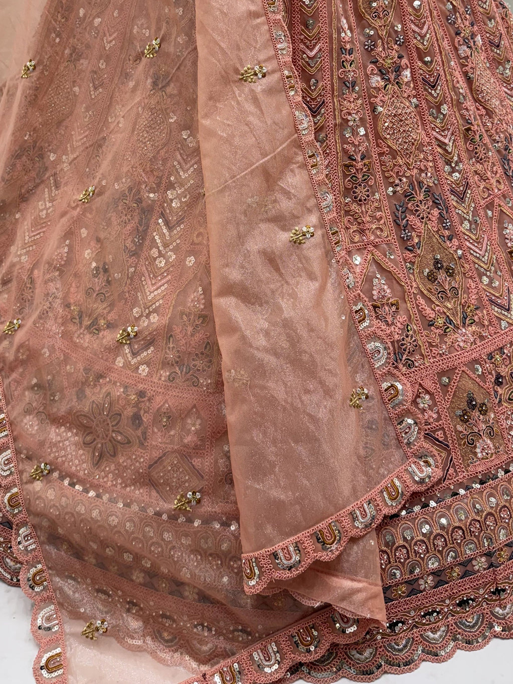 Peach Shiny Embroidered Net Reception Wear Lehenga Choli With Dupatta