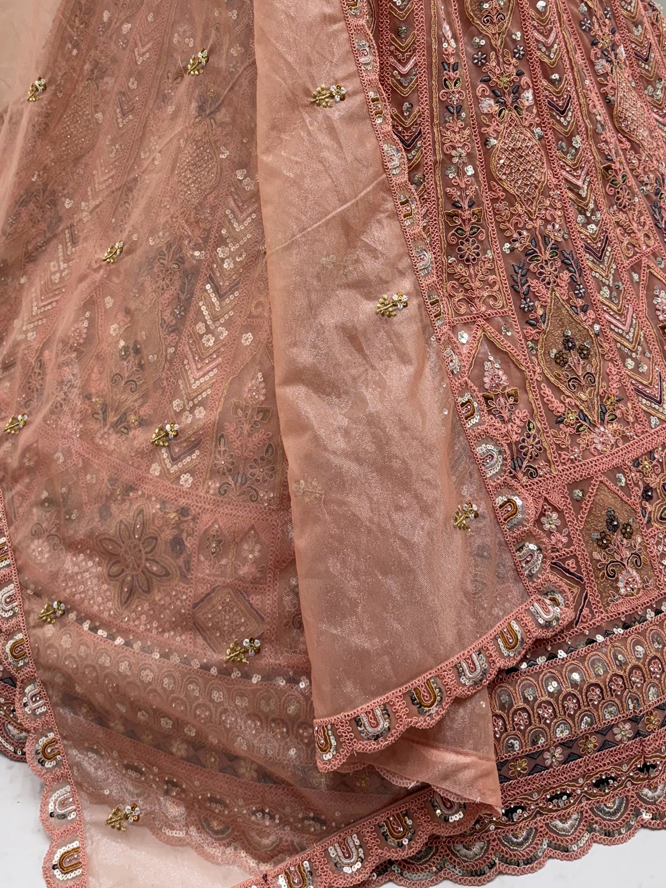 Peach Shiny Embroidered Net Reception Wear Lehenga Choli With Dupatta