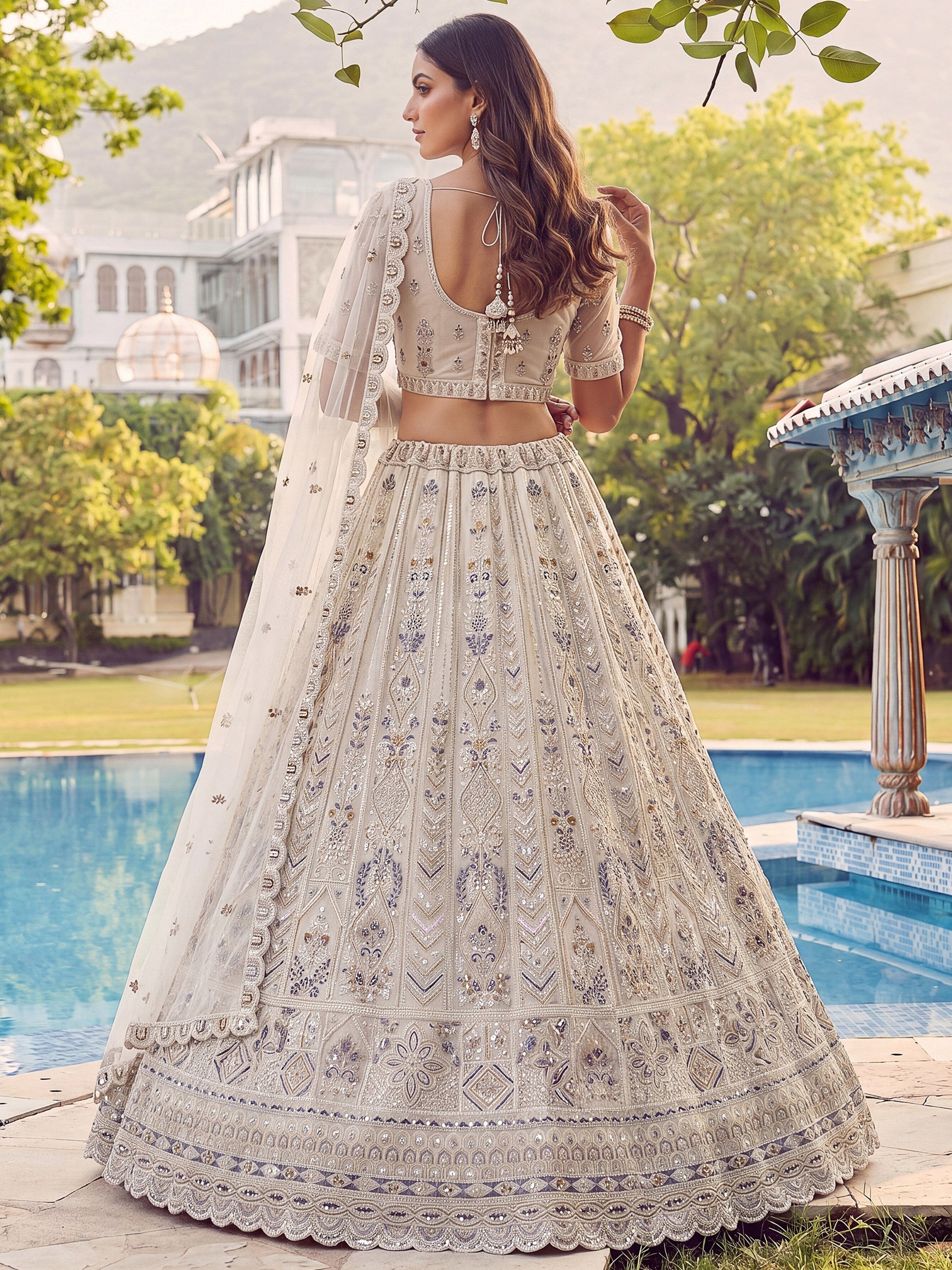 Cream Shiny Embroidered Net Reception Wear Lehenga Choli With Dupatta