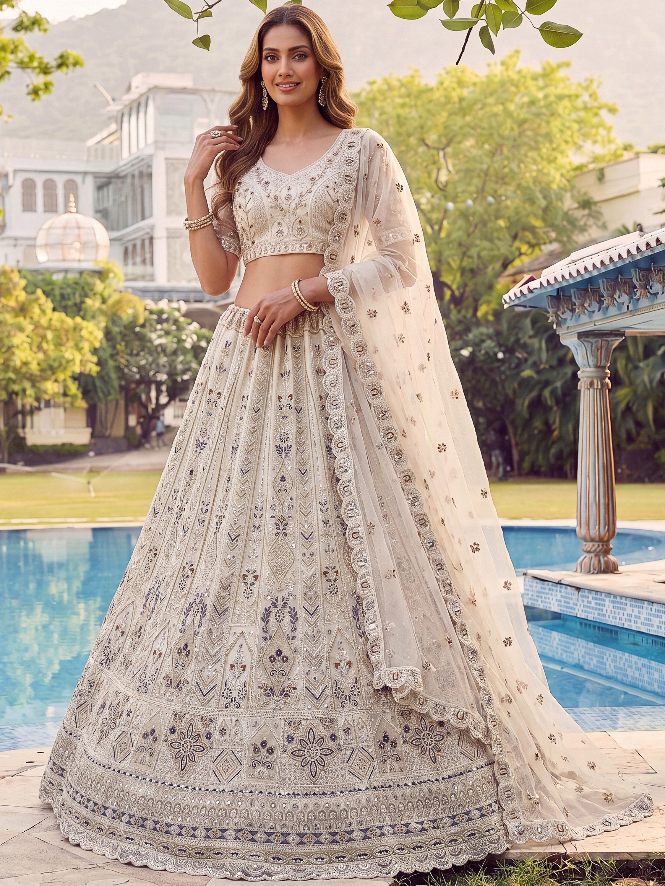 Cream Shiny Embroidered Net Reception Wear Lehenga Choli With Dupatta