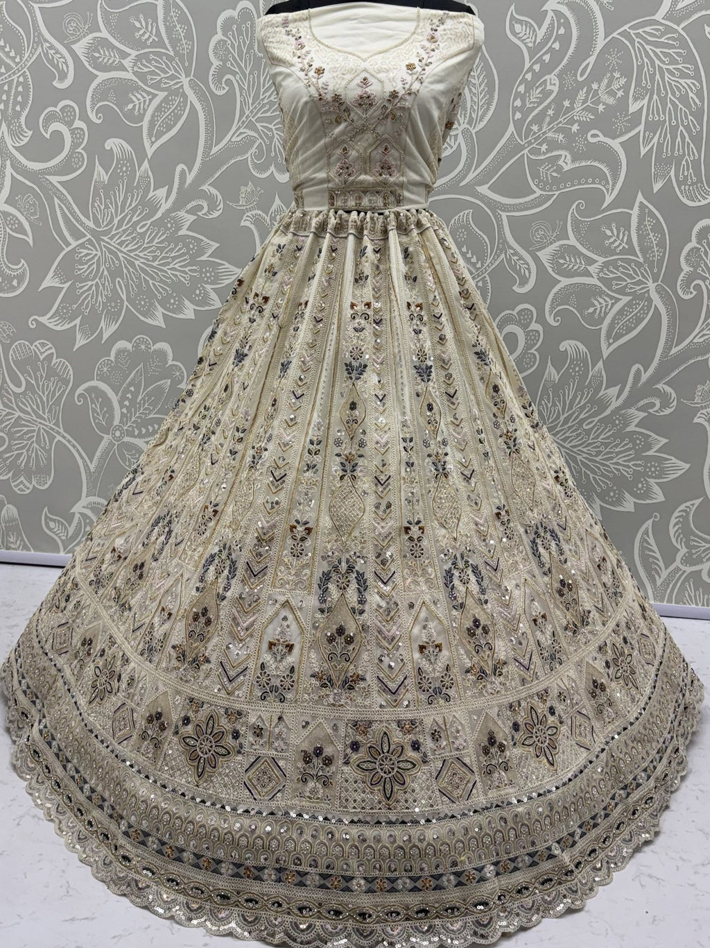 Cream Shiny Embroidered Net Reception Wear Lehenga Choli With Dupatta