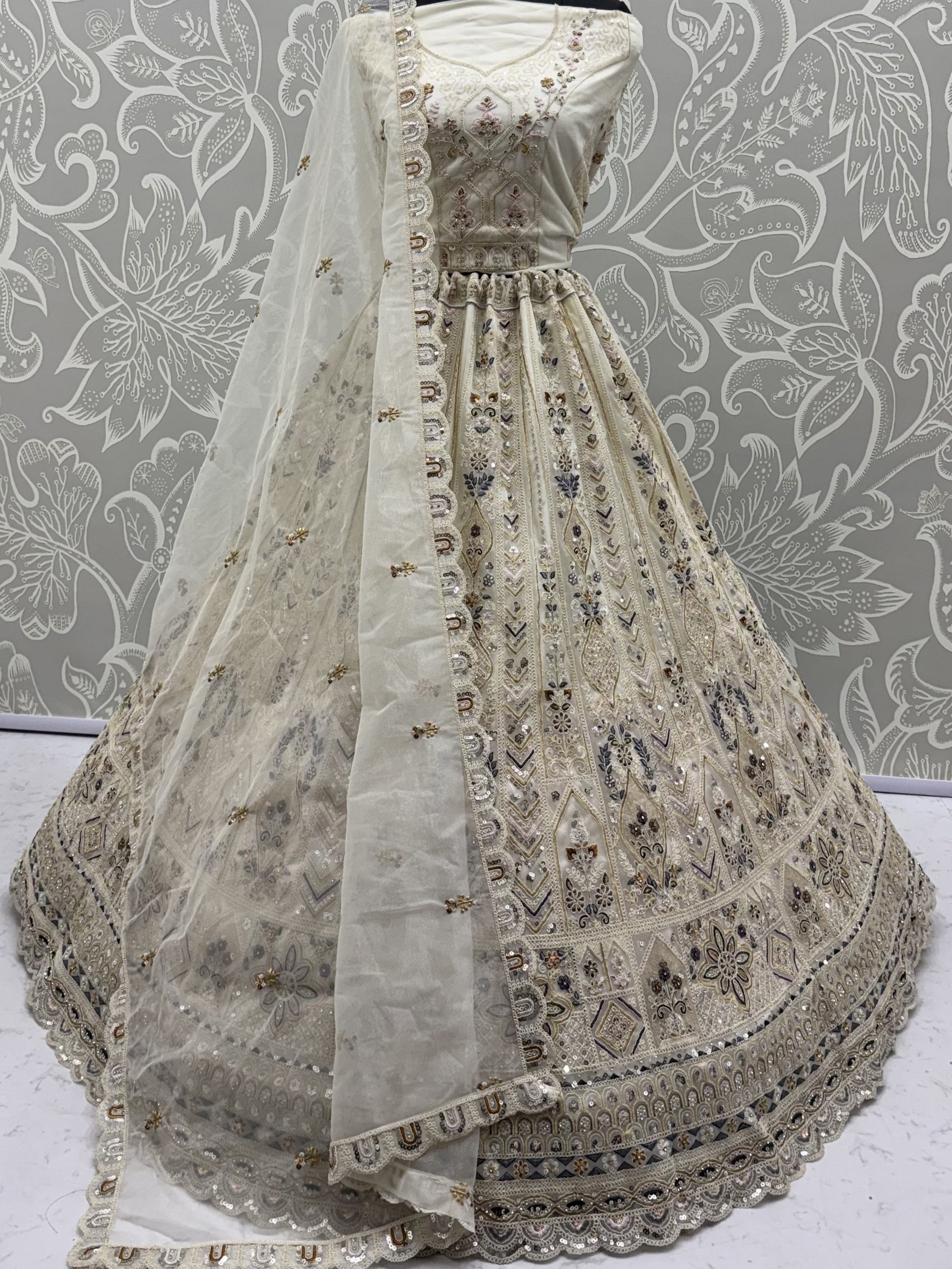 Cream Shiny Embroidered Net Reception Wear Lehenga Choli With Dupatta