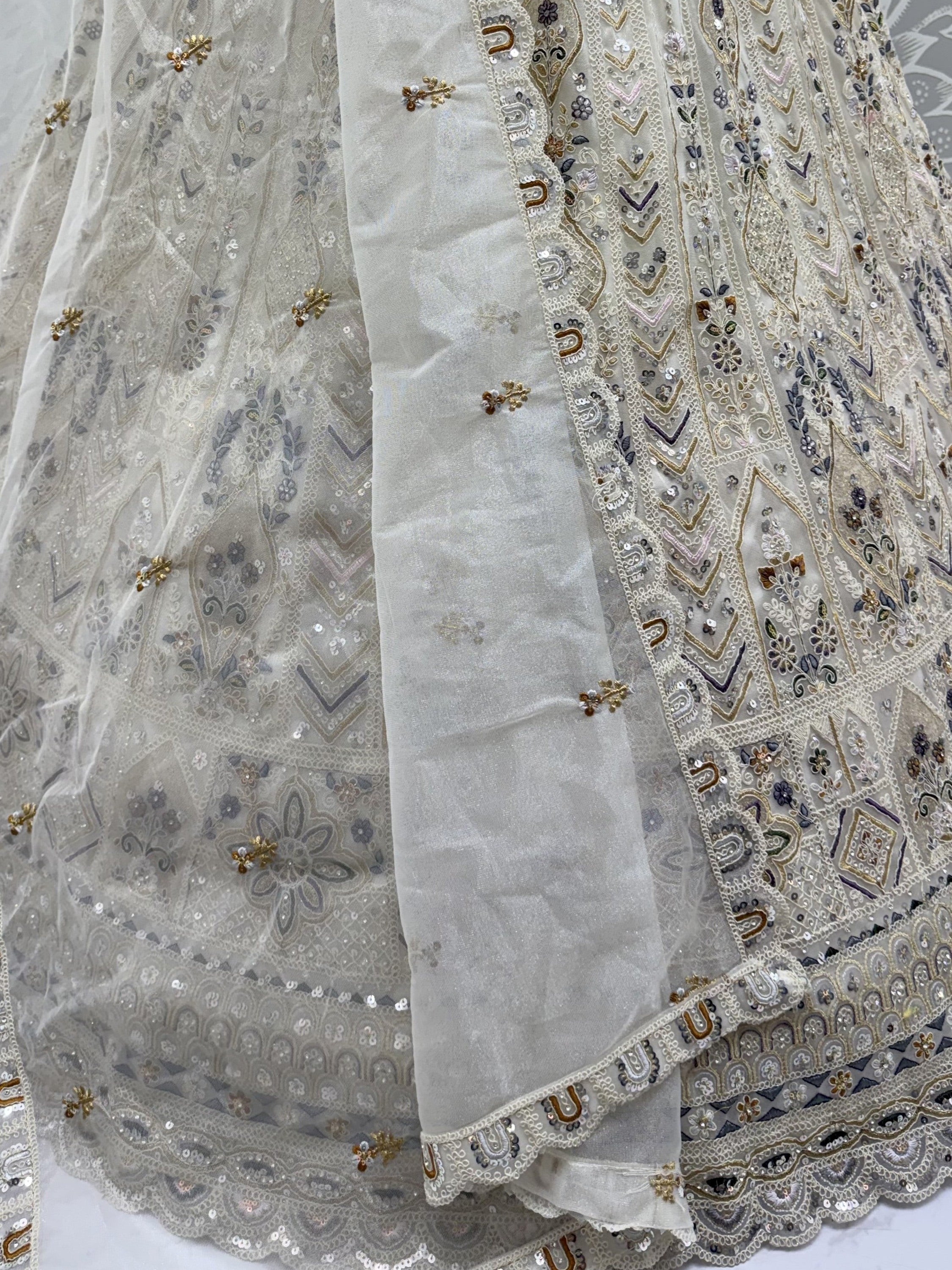 Cream Shiny Embroidered Net Reception Wear Lehenga Choli With Dupatta