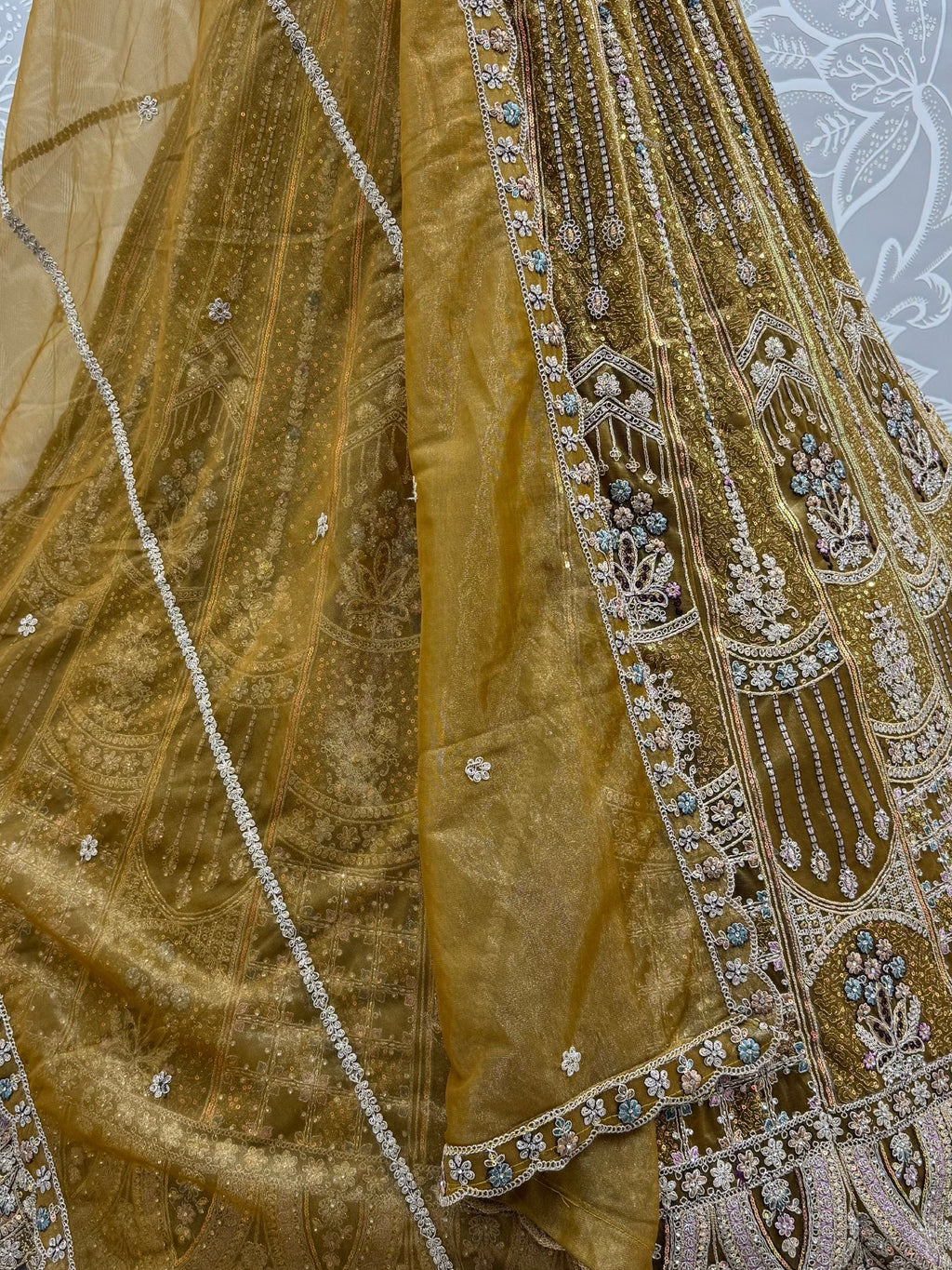 Dazzling Golden Multi Thread Work Net Reception Wear Lehenga Choli