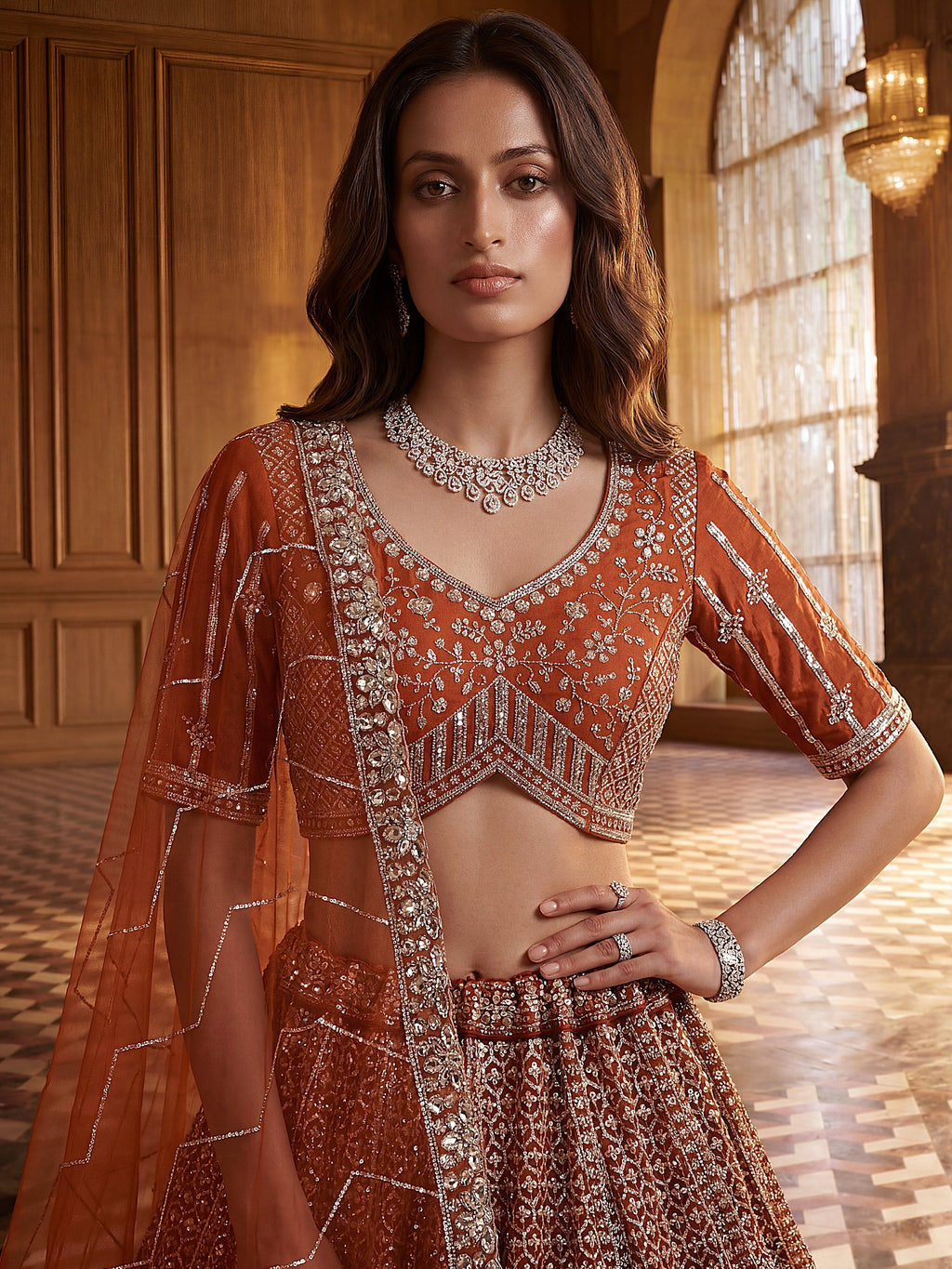 Wonderful Rust Orange Sequins Net Wedding Wear Lehenga Choli